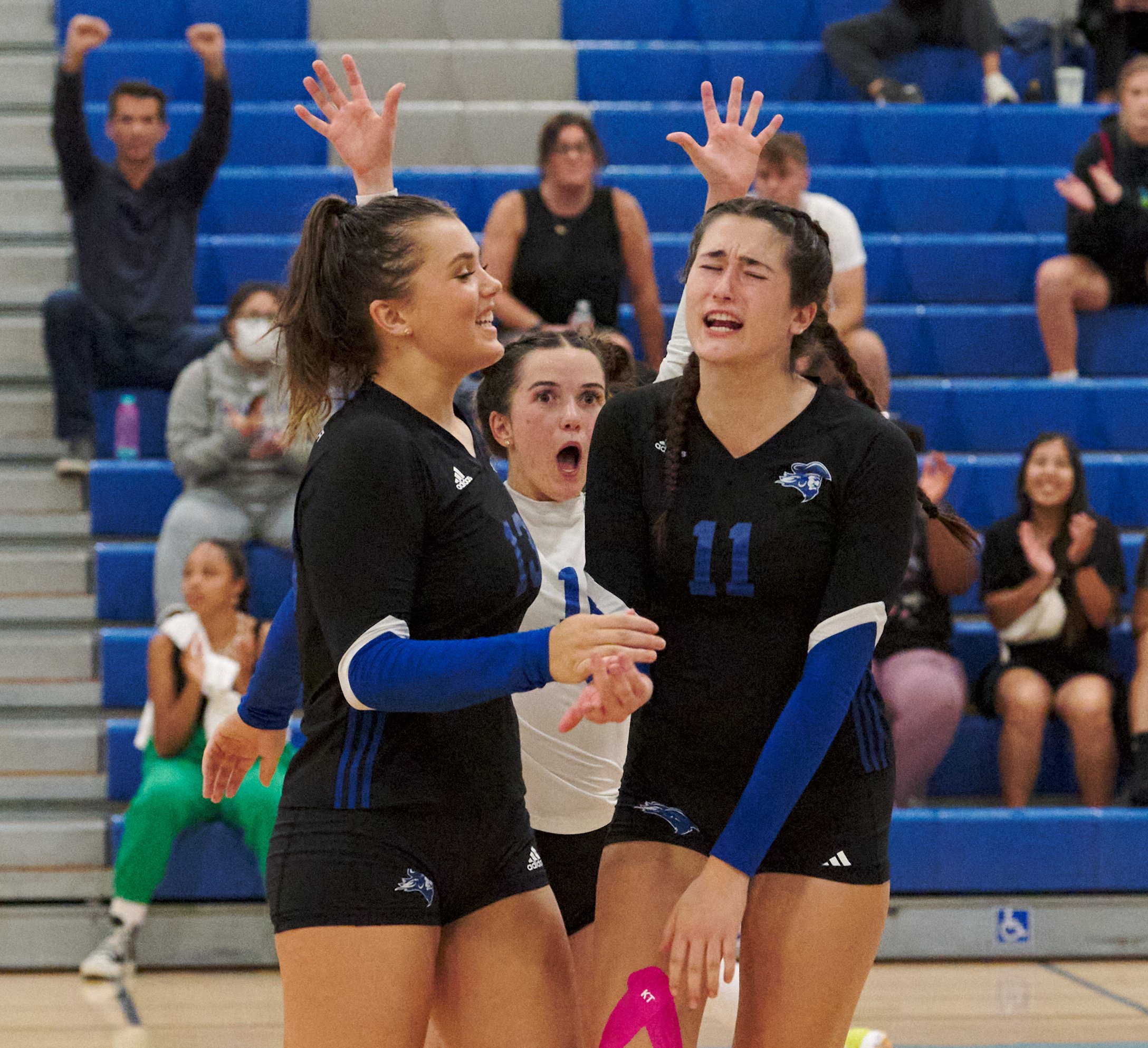  Santa Monica College Corsairs' Mackenzie Wolff, Halle Anderson (rear), and Maiella Riva after scoring a point during the women's volleyball match against the Moorpark College Raiders on Friday, Sept. 23, 2022, at the Corsair Gym in Santa Monica, Cal