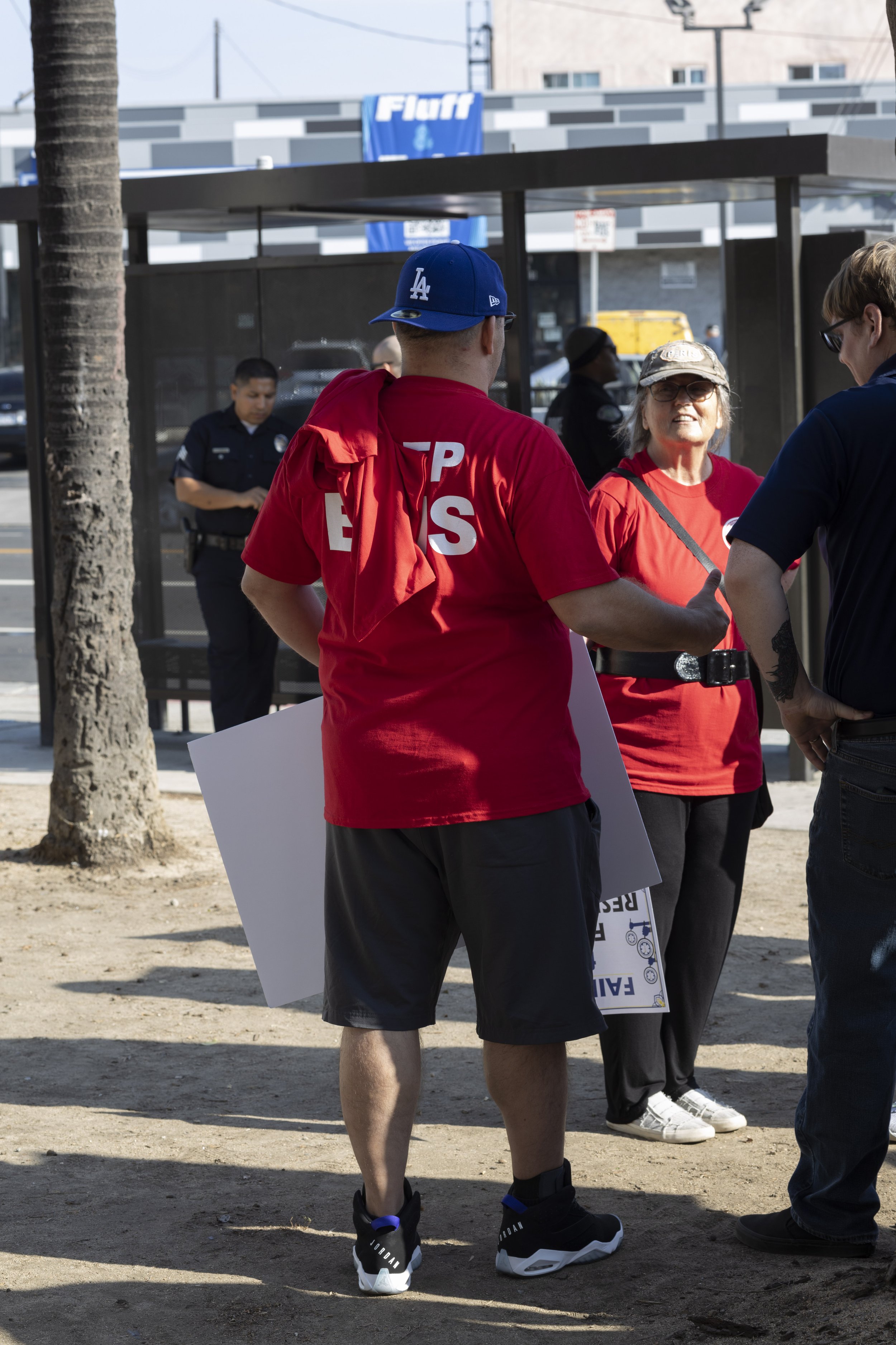  Katherine Shage, middle, who helped organize the march for fair wages for EMS workers, speaking with everyone before heading out on the march over the sixth street bridge into downtown Los Angeles. East Los Angeles, Calif. September 13, 2022. (Jamie