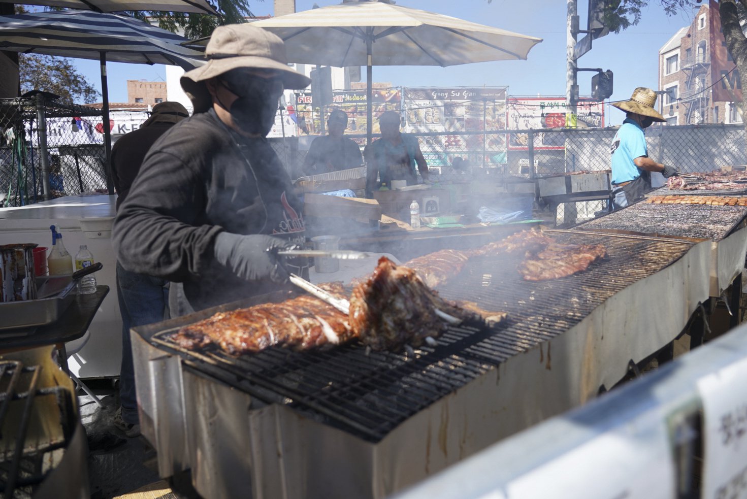 A grillmaster prepares pork belly and barbeque during the 49th annual Los Angeles Korean Festival Friday, September 23 2022 at the Seoul International Park. Vendors offered tradition street food representing all eight provinces of Korea during the t