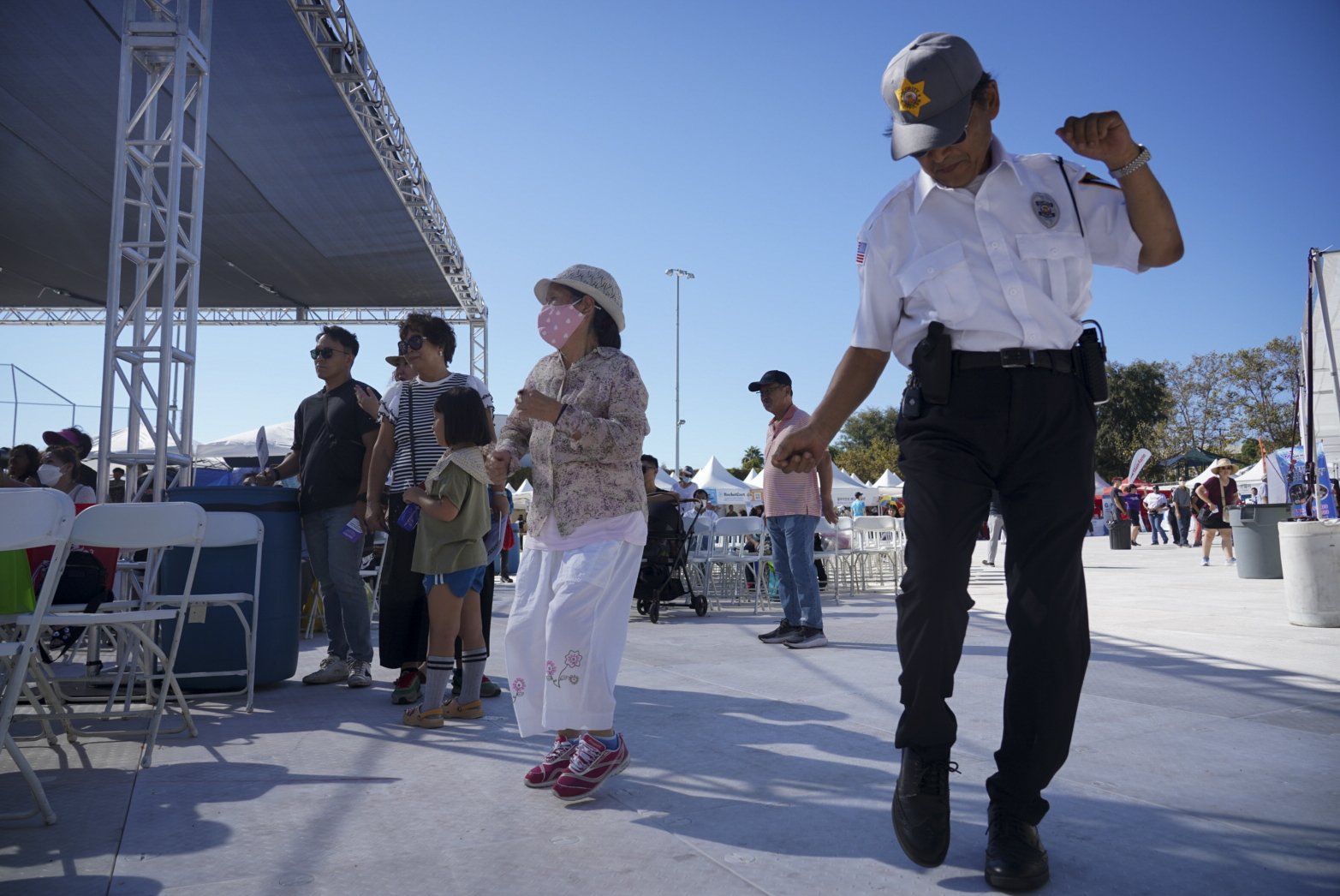  A security guard gets jiggy with it during a Get Up and Move class as part of the 49th annual Los Angeles Korean Festival Friday, September 23 2022 at the Seoul International Park. The Wallis Annenberg GenSpace offers the Get Up and Move class as we