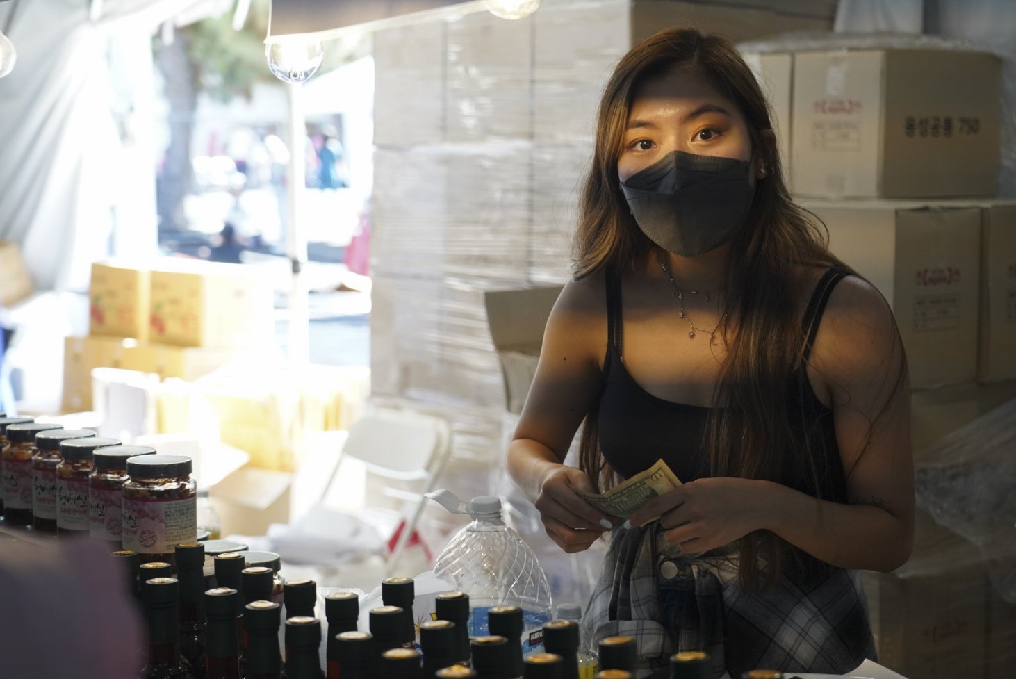  A shopkeeper conducts business during the 49th annual Los Angeles Korean Festival Friday, September 23 2022 at the Seoul International Park. The 49th incarnation marks the return of the in-person festival following a two-year COVID hiatus.  (The Cor