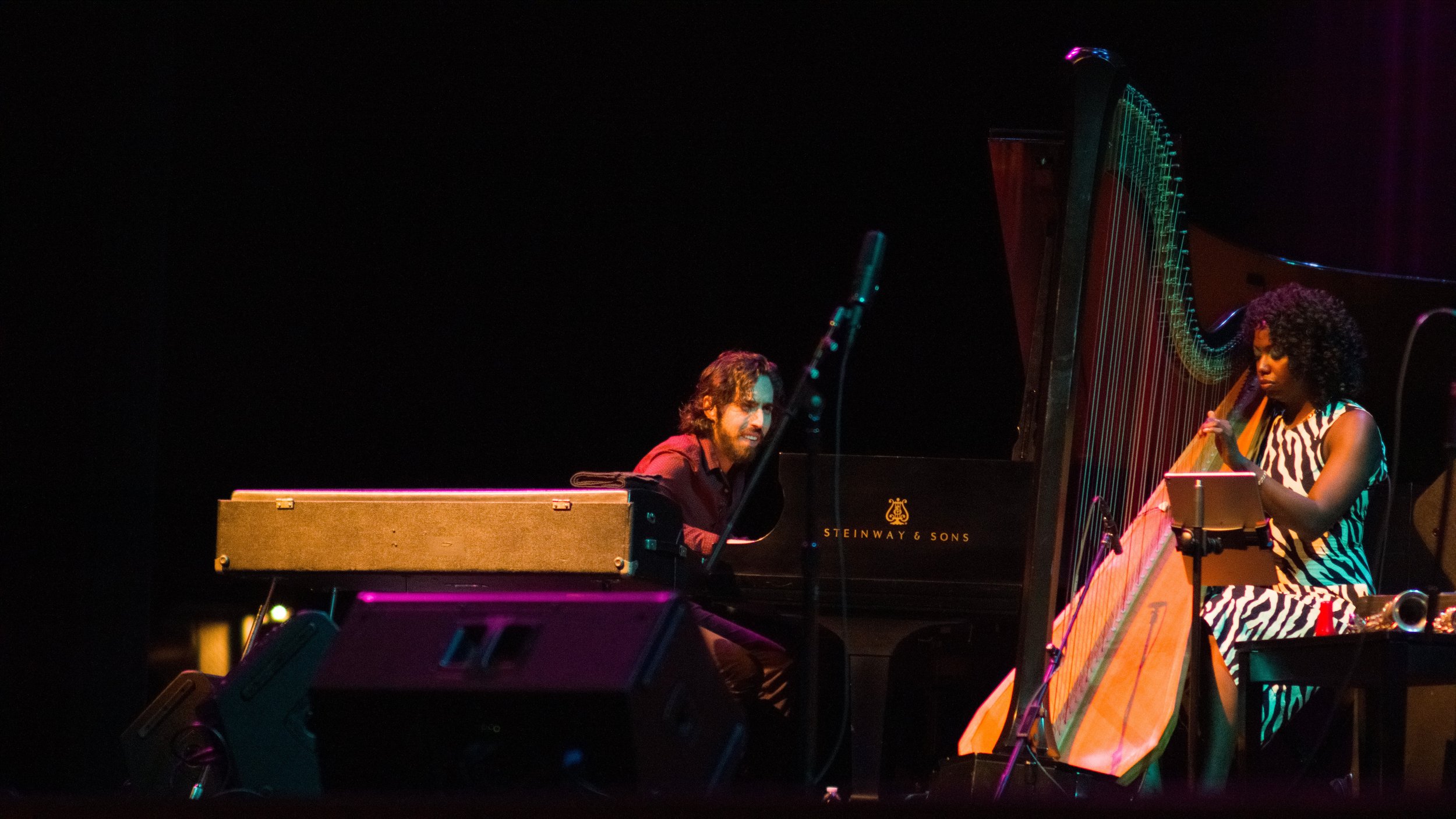  Gadi Lehavi (left) plays piano with Brandee Younger on harp (right) at the Santa Monica College Performing Arts Center, Santa Monica, Calif. as part of Ravi Coltrane's group on Sept. 23 2022. It was the birthday of Ravi Coltrane's late father John C
