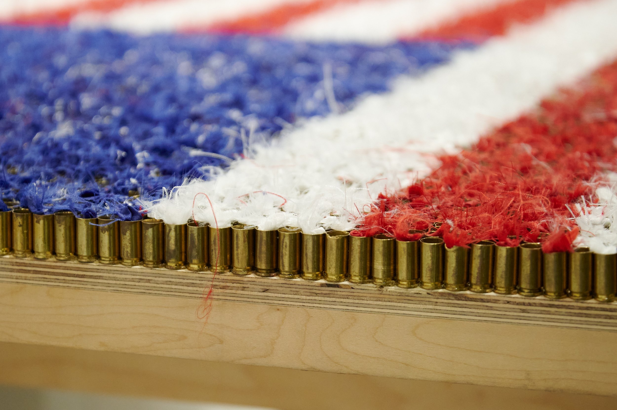  Artist Sol Hill's work, "Caseload," is comprised of 20,835 bullet casings, signifying the number of gun killings in the USA in 2021, excluding suicide, and are stuffed with shredded American flags. On display at The Other Art Fair on Thursday, Sept.