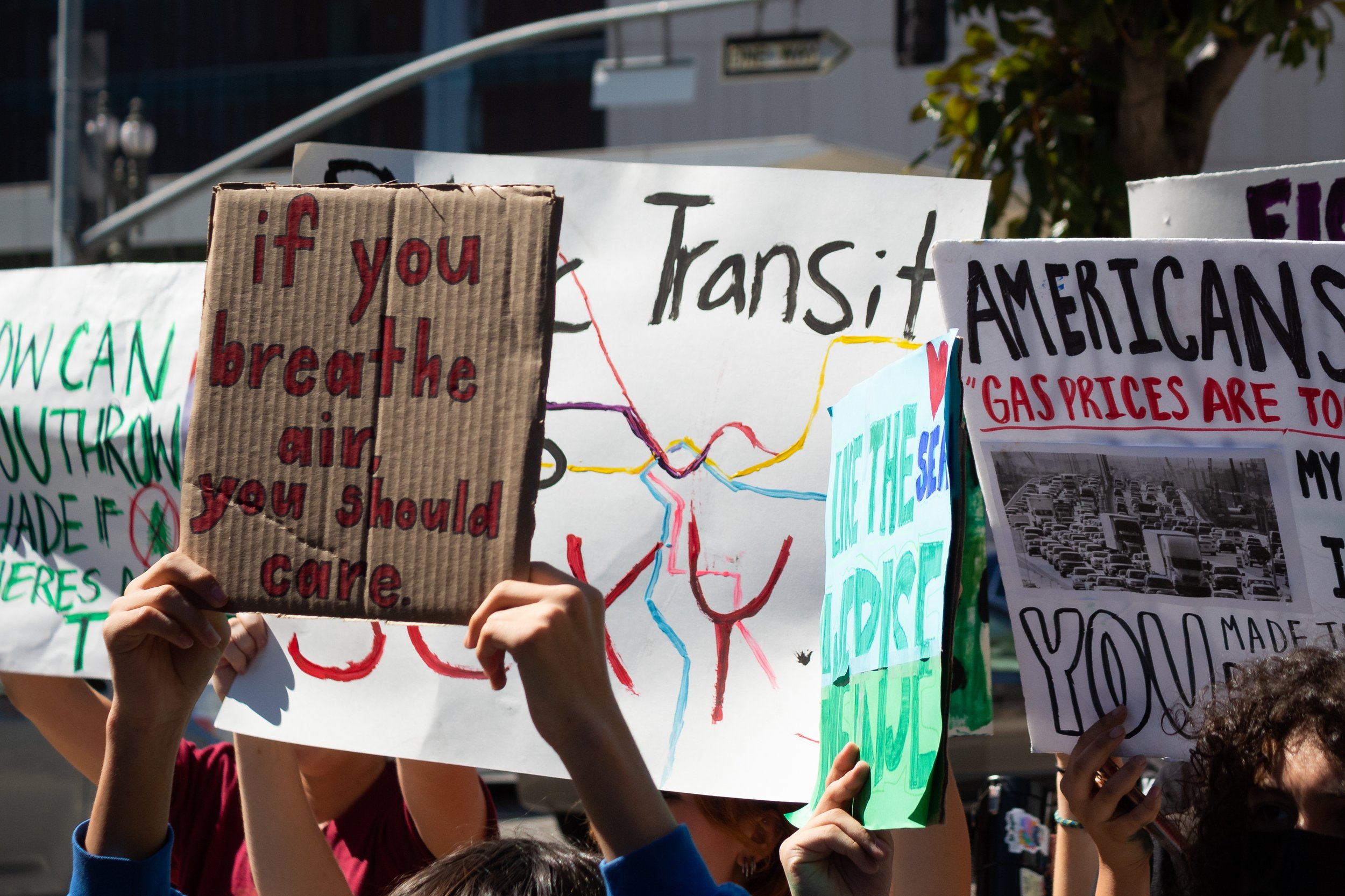  Signs being held by strikers from the Youth Climate Strike on 1st Street in Los Angeles, Calif. on Sept 23, 2022. (Caylo Seals | The Corsair) 