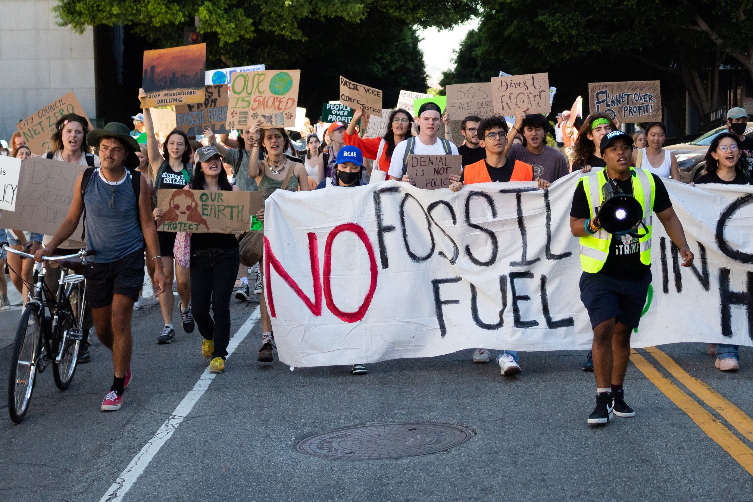  Sim Bilal (left) leading a large crowd of people down Temple Street during the Youth Climate Strike. Sim is the main organizor and director for the Youth Climate Strike in Los Angeles, Calif. on Sept. 23, 2022. (Caylo Seals | The Corsair) 