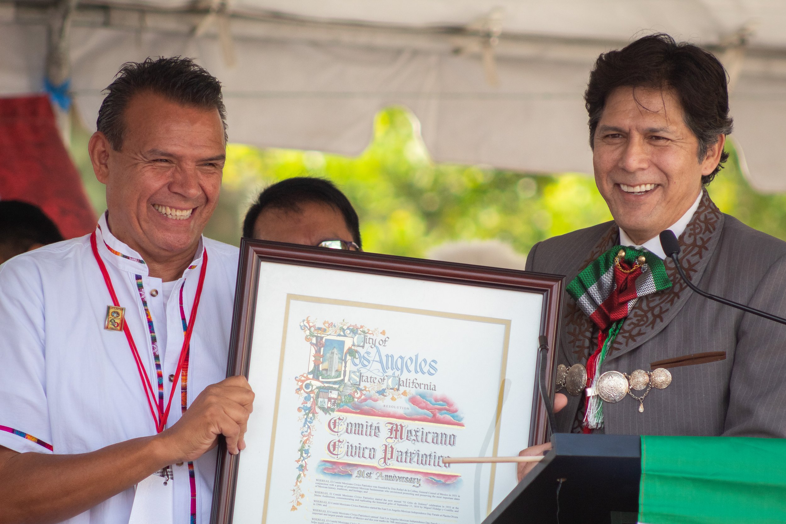  Francisco Moreno (right) receiving plaque commemorating the Comité Mexicano Civivo Patriotico 91st anniversary from Los Angeles City Council member Kevin De León (district 14) at the Mexican Independence Day Parade & Festival in East Los Angeles, Ca
