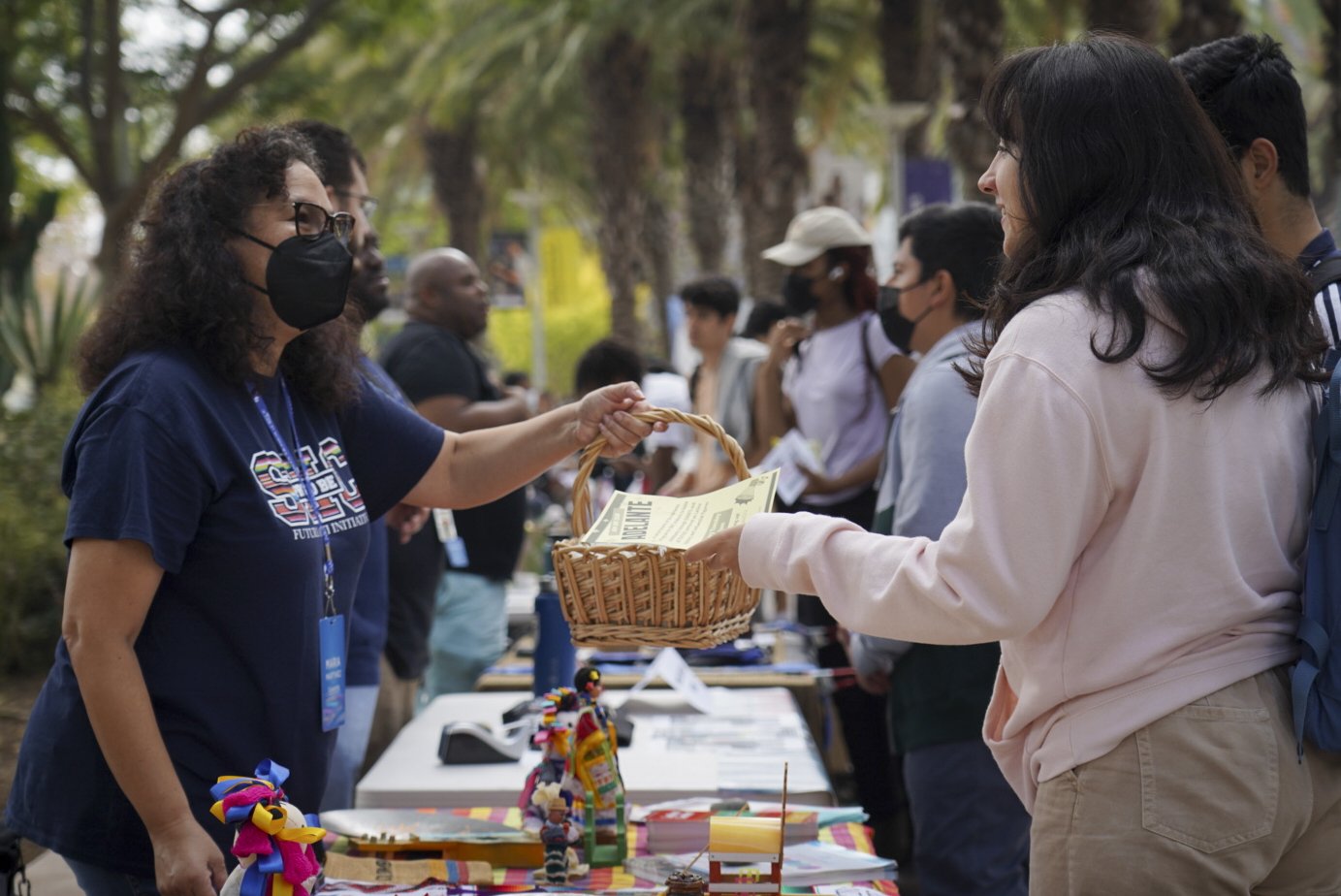  Maria Martinez, Santa Monica College Latino Center Council, greets a student during the SMC Club Awareness Day Thursday, Sept. 29 2022. The Latino Center offers prospective attendees a number of exclusive classes and counseling services to aid in pr