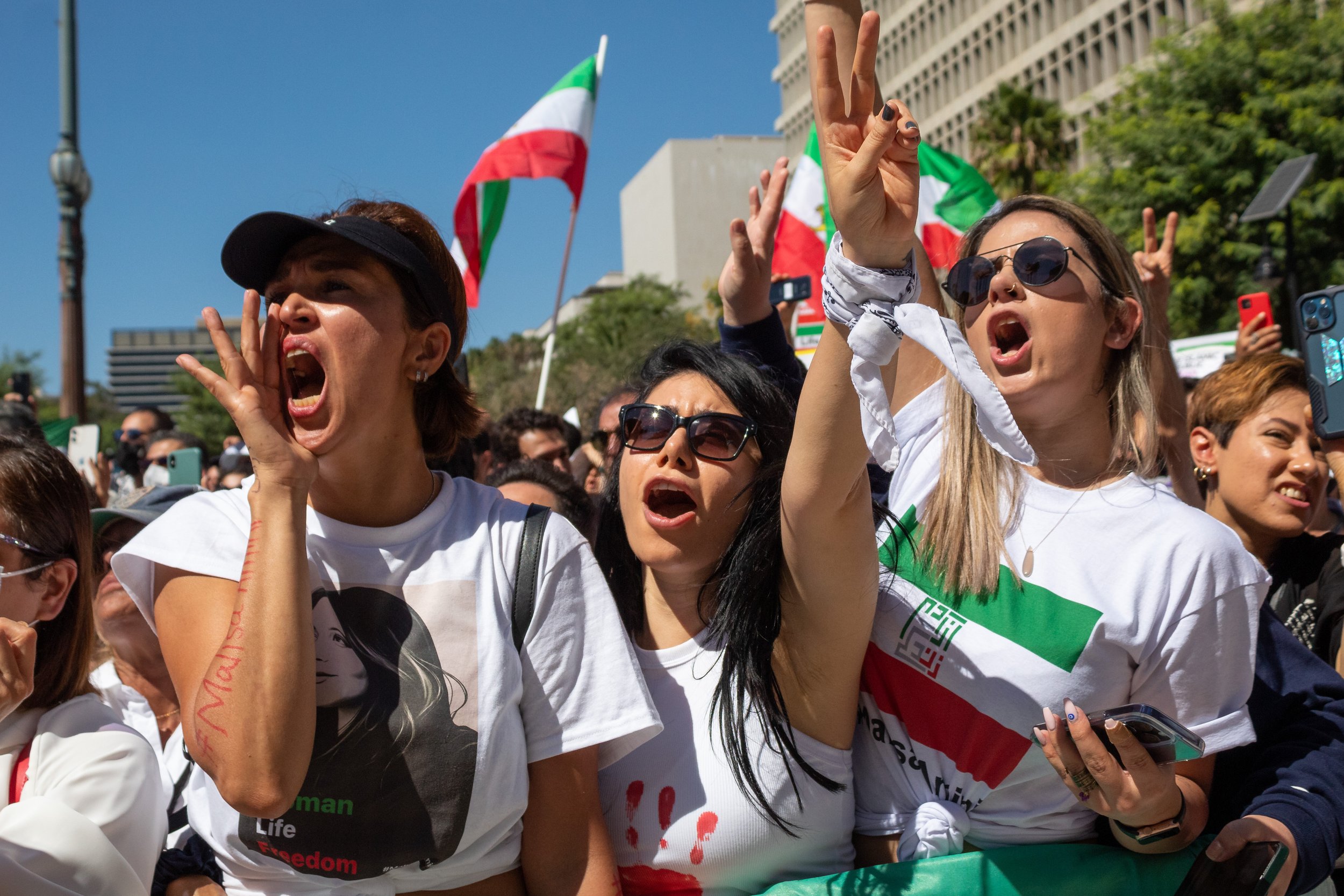  Maryam Mohebfar (left), Ashley (middle), and Diba (right) cheering at the Freedom for Iran rally on the steps of Los Angeles City Hall. The rally marched from Pershing Square with at least a thousand people in attendance as well as being part of a l