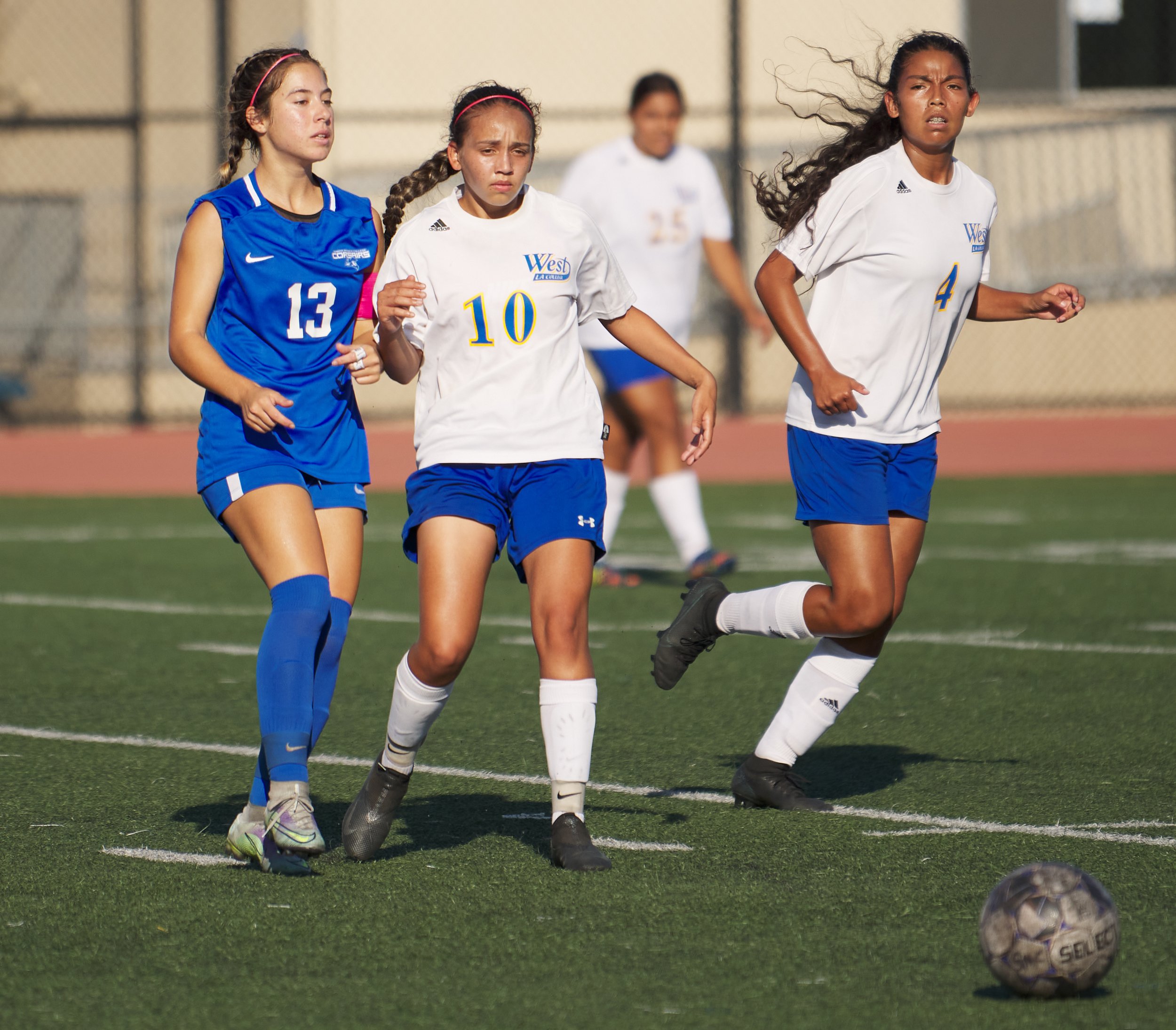  West Los Angeles College Wildcats' Leslie Flores (center), with Mary Godinez (right), fails to steal the ball from Sophie Doumitt (left), of the Santa Monica College Corsairs, at the women's soccer match on Friday, Sept. 30, 2022, at Corsair Field i