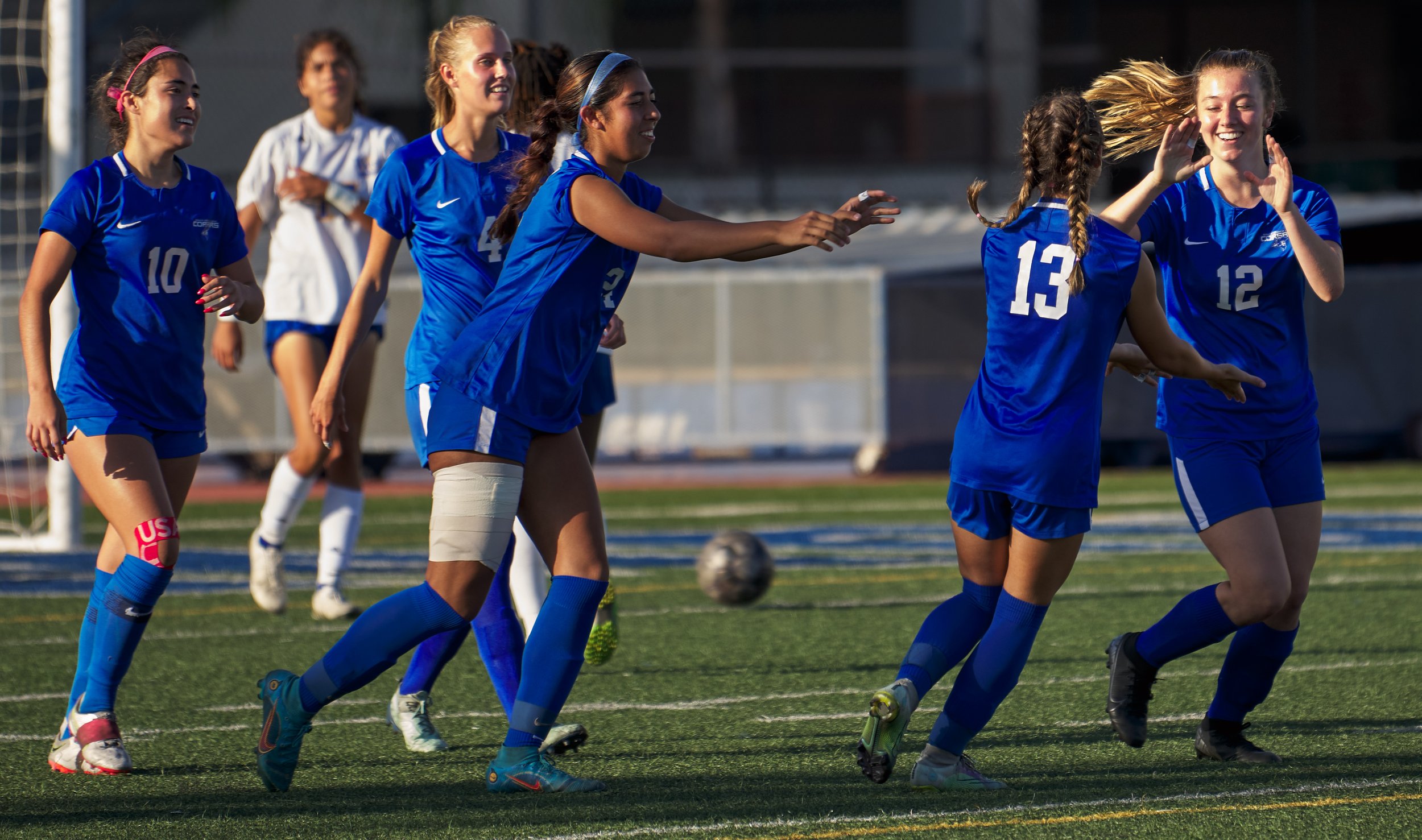  Members of the Santa Monica College Corsairs Women's Soccer team celebrate Eden Hotch's (right) goal duing the match against the West Los Angeles College Wildcats on Friday, Sept. 30, 2022, at Corsair Field in Santa Monica, Calif. The Corsairs won 3