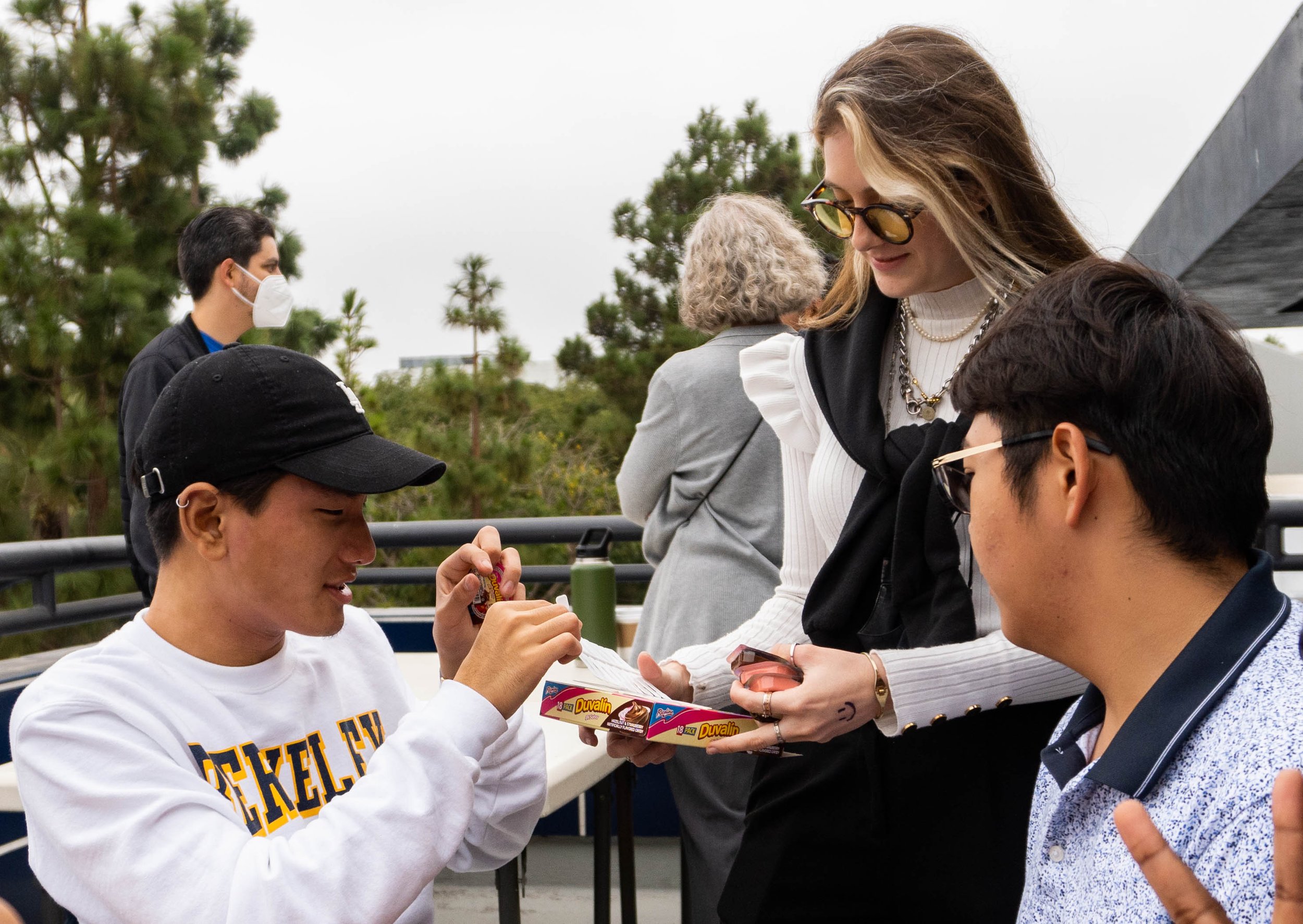  Santa Monica College International Student Forum (ISF) members, Traves Lee, Andrea Giraldo and Oscar Chien try Duvalin, a Mexican hazelnut and vanilla flavored candy during ISF's Snacks Appreciation Day on Oct. 5, 2022. Santa Monica, Calif. (Ee Lin 