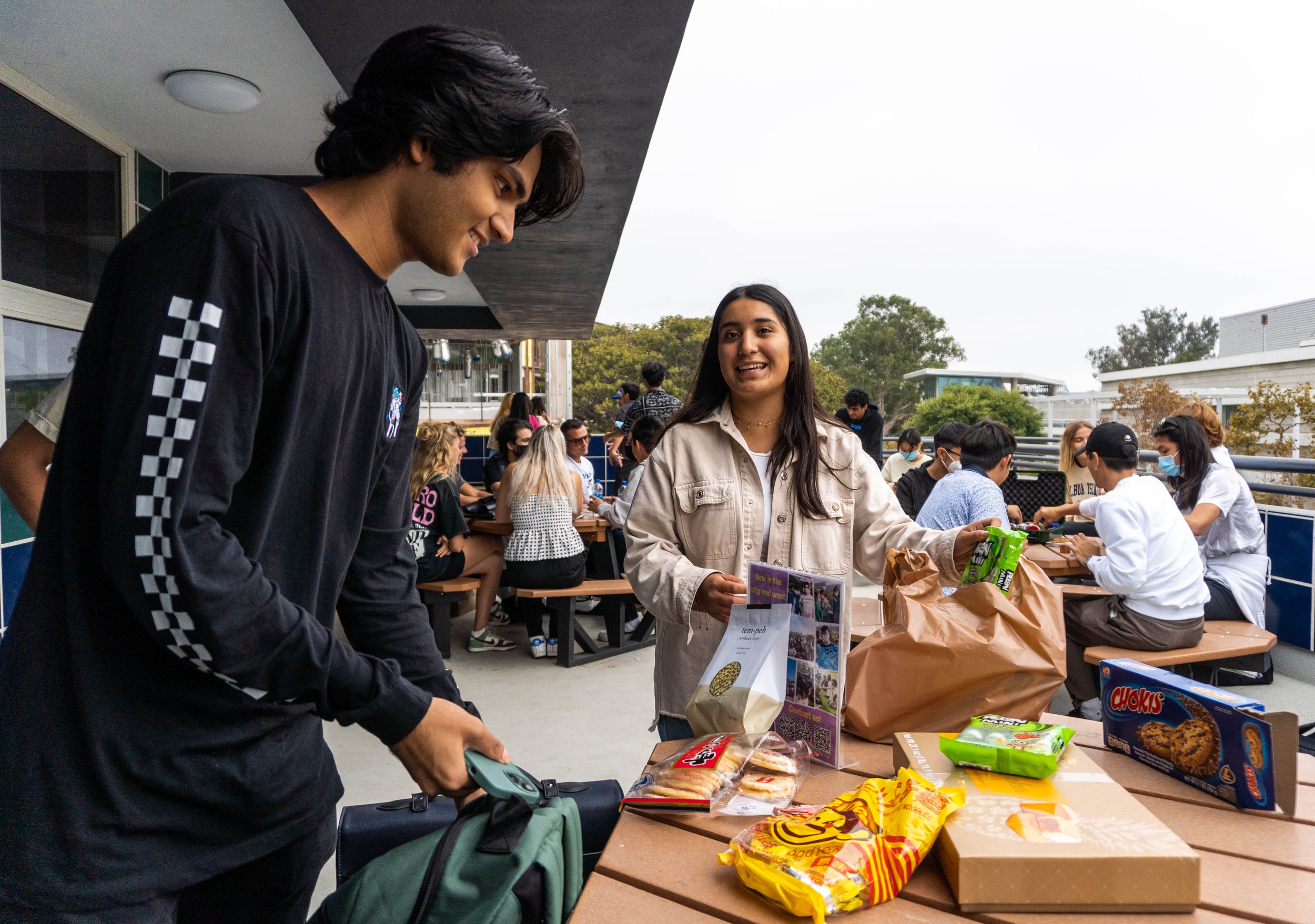  (L-R) Sharar Chowdhury, Club Delegate, and Abril Olivares Nolasco, President of the Santa Monica College International Student Forum (ISF) lay out the snacks their club members brought from their hometowns during the ISF's Snacks Appreciation Day on