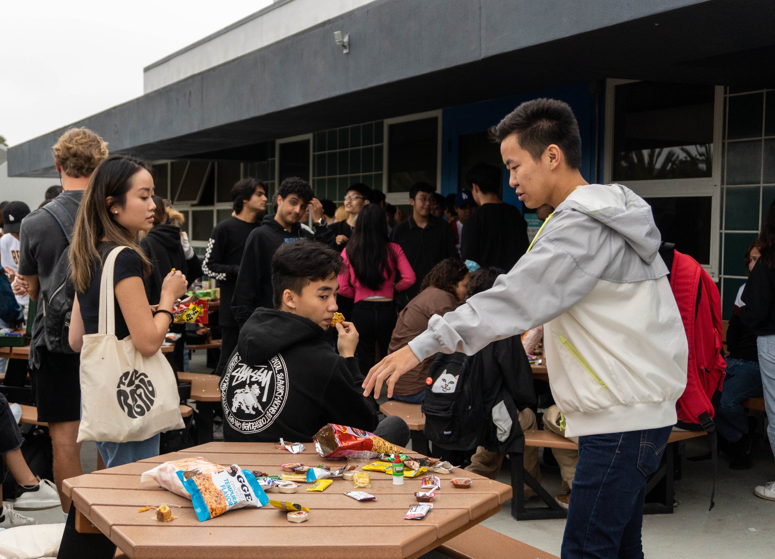  Cambodian International student, Orgil Boldbaatar about to pick a snack from the table filled with assortments of treats from all over the world during Snacks Appreciation Day. The event was held by the Santa Monica College International Student For