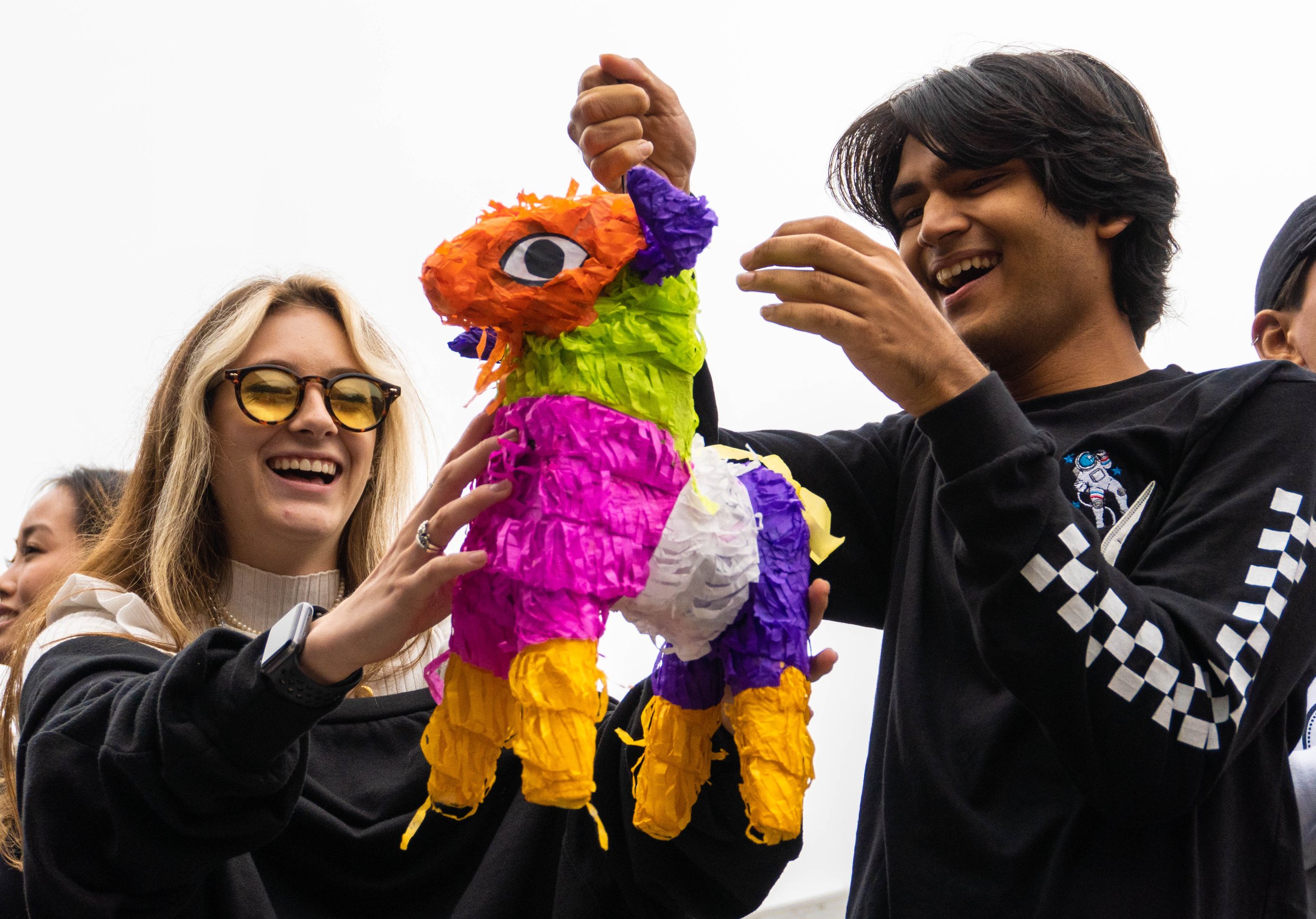  (L-R) Andrea Giraldo and Sharar Chowdhury, the Club Delegate of the Santa Monica College International Student Forum (ISF) examine a piñata, brought in by a student from Mexico during the ISF's Snacks Appreication Day. Oct. 5, 2022. Santa Monica, Ca