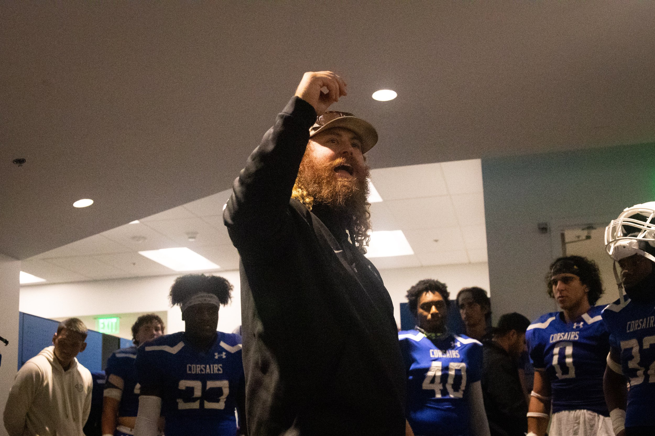  Santa Monica College football coach Kelly Ledwith talking to the Corsairs during halftime in a recent home game against Moorpark College Raiders on Thursday, Oct. 13, 2022. At halftime the Cosairs were down 21-6, and the game ended favor of the Raid