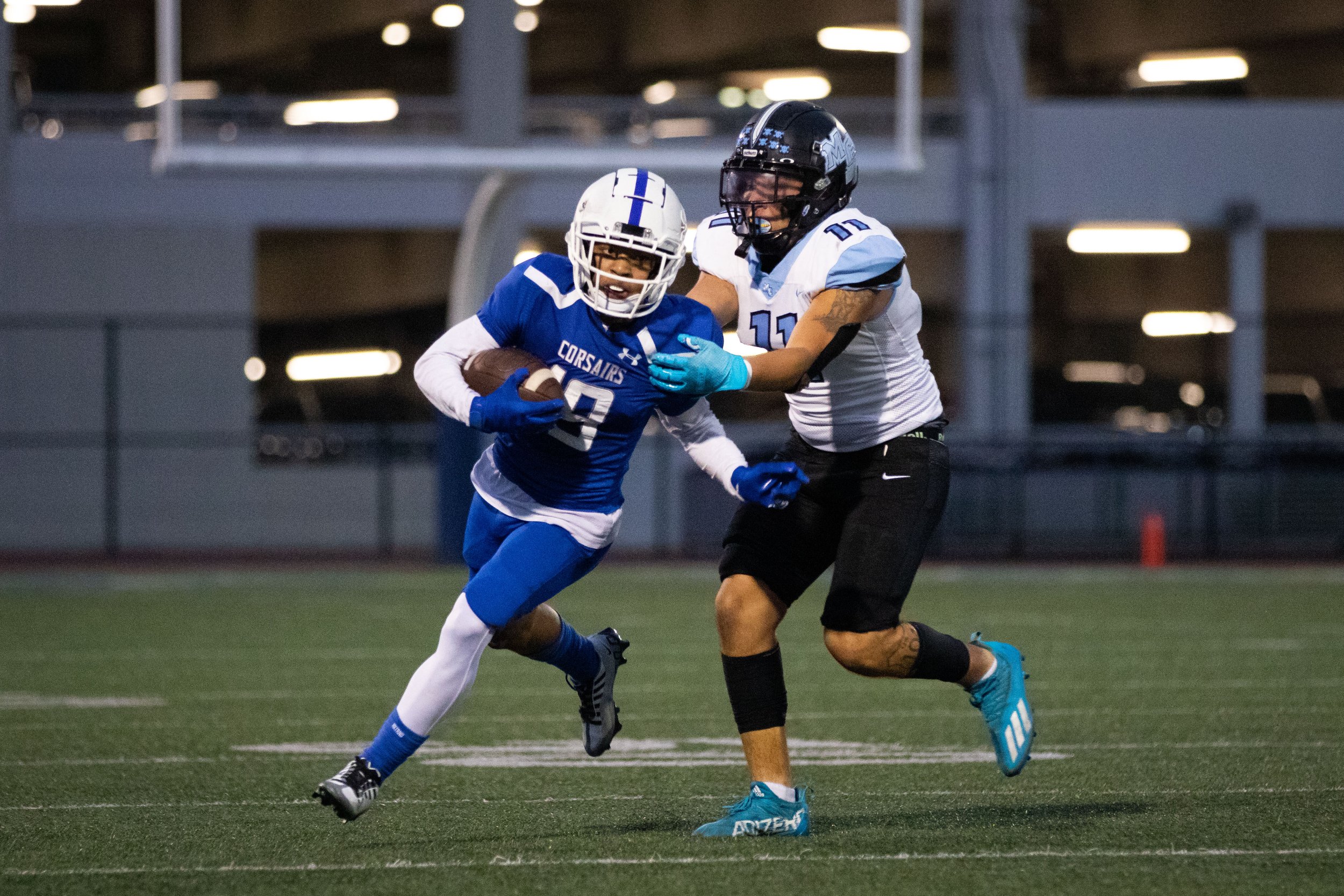  Santa Monica College Corsair  wide receiver Darren Tenner-Taylor (19, left) about to be tackled by Moorpark College Raider Louis Ortiz (11, right) after receiving a punt during the first quarter of a recent home game on Thursday, Oct. 13, 2022 at Sa