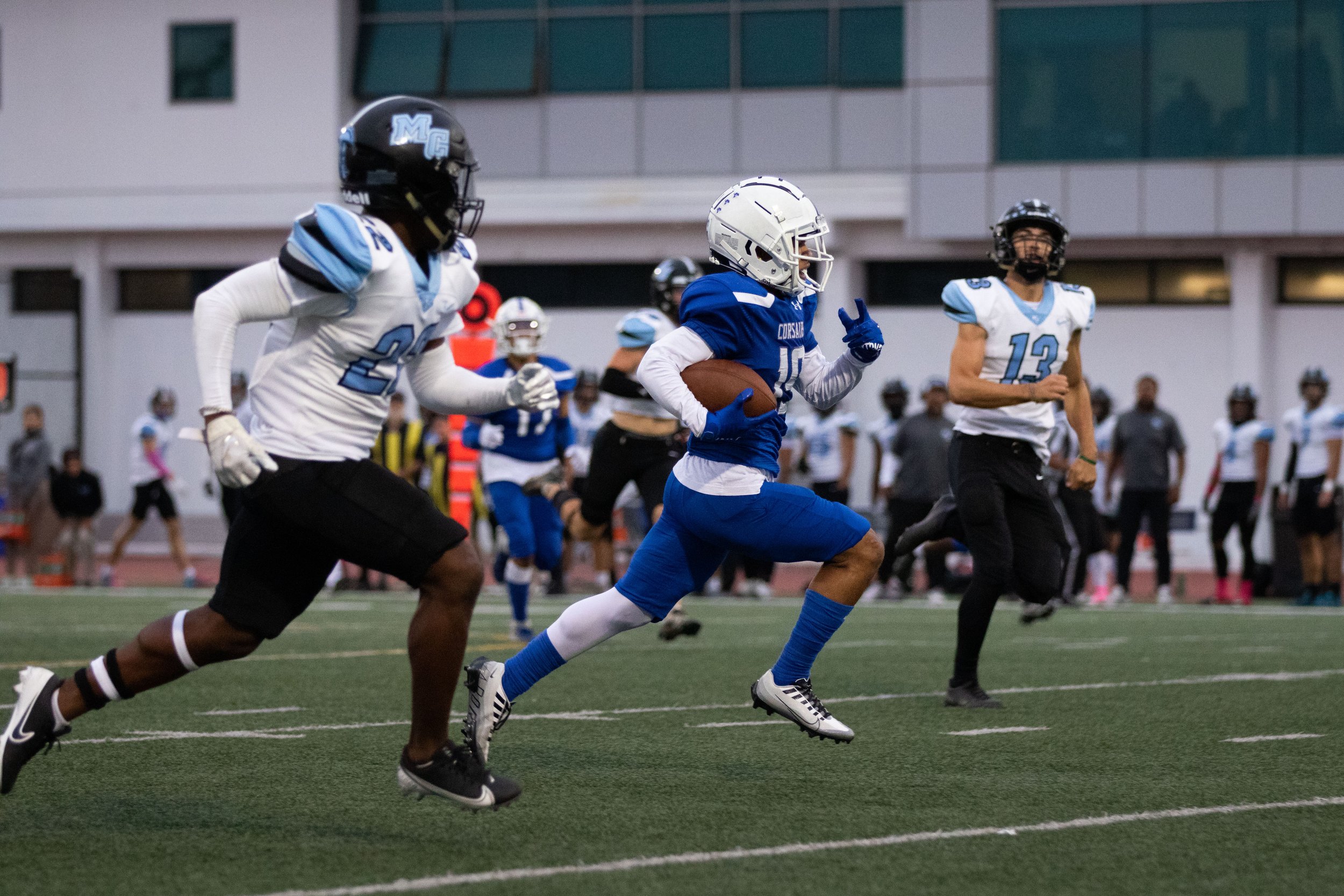  Santa Monica College Corsair wide receiver Darren Tenner-Taylor (19, middle) on his way to score the first touchdown in the recent home game against Moorpark College on Thursday, Oct. 13, 2022. Tenner-Taylor is being chased my Moorpark College Raide