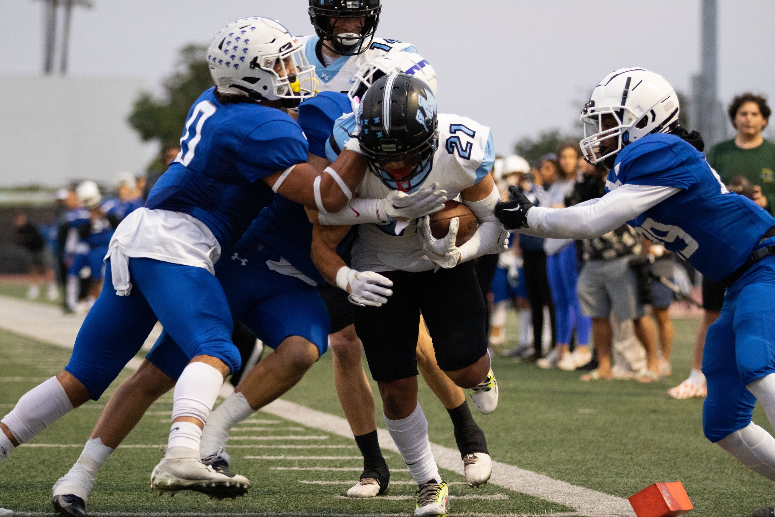  Santa Monica College Corsairs attempting to block Moorpark College Raider Gabe Landless (21) from scoring a touchdown during the first quarter of the game. The game on Thursday, Oct. 13, 2022 at Santa Monica College, Santa Monica, Calif. went in the