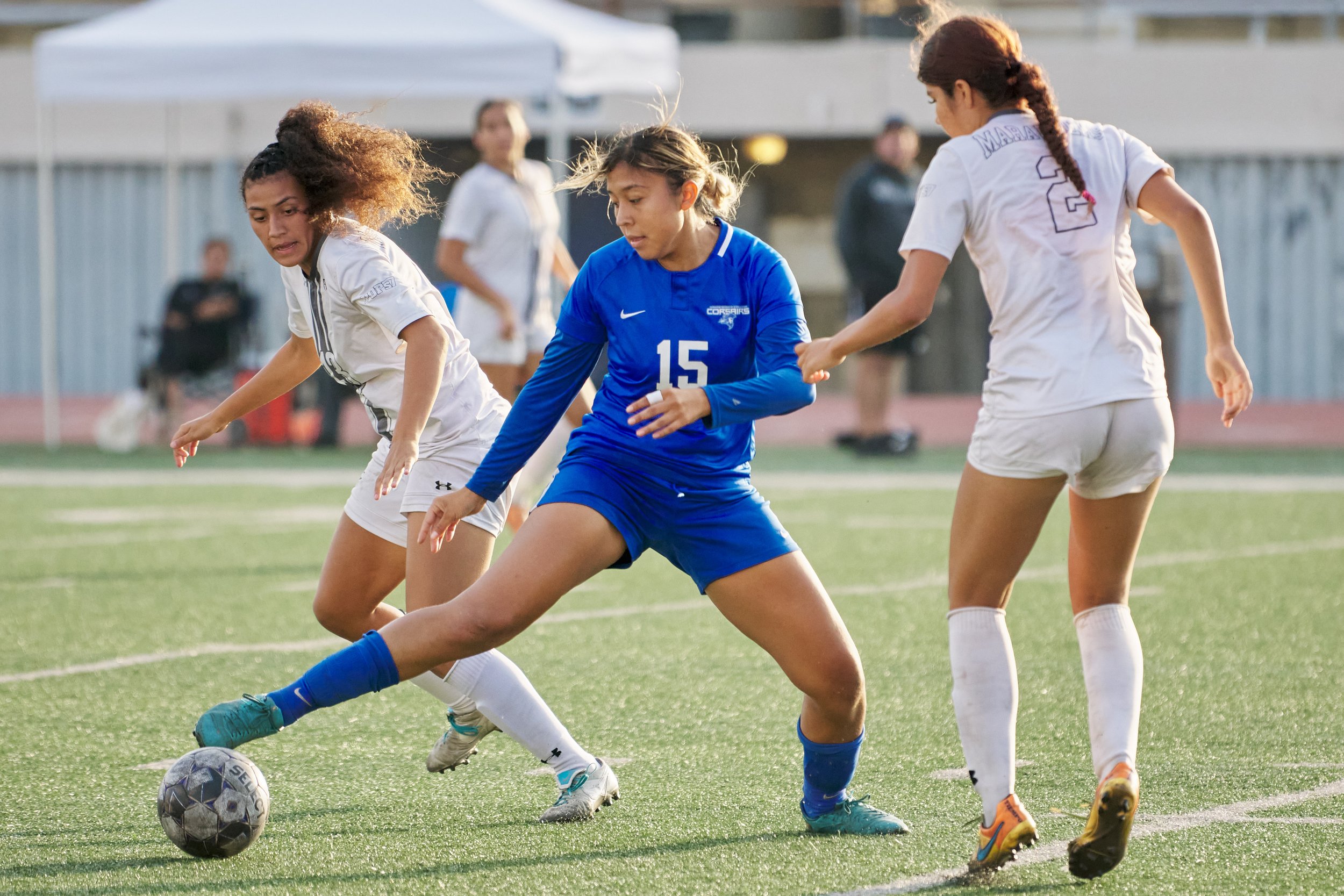  Santa Monica College Corsairs' Julia Pioli (center) keeps control of the ball away from Antelope Valley College Marauders' Cassi James (left) and Kaylin Gonzalez (right) during the women's soccer match on Tuesday, Oct. 11, 2022, at Corsair Field in 
