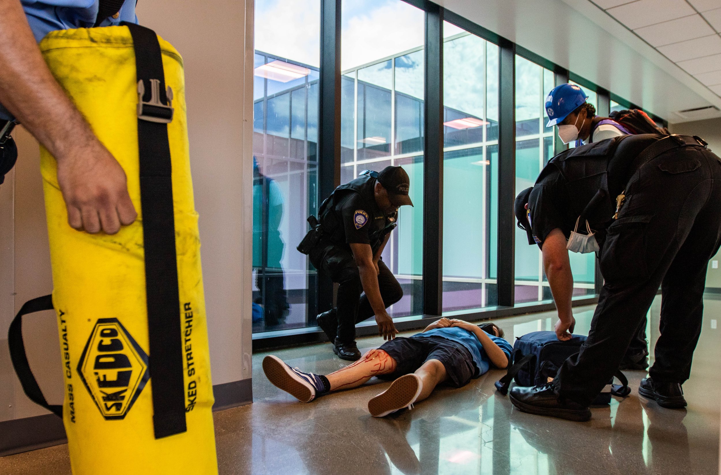  Alex Bonin, one of the simulated injury drill participants of the 2022 ShakeOut SoCal Earthquake Drill and Media Event receives assistance from the Santa Monica College (SMC) Police Department and Campus Emergency Response team as they evacuate Boni