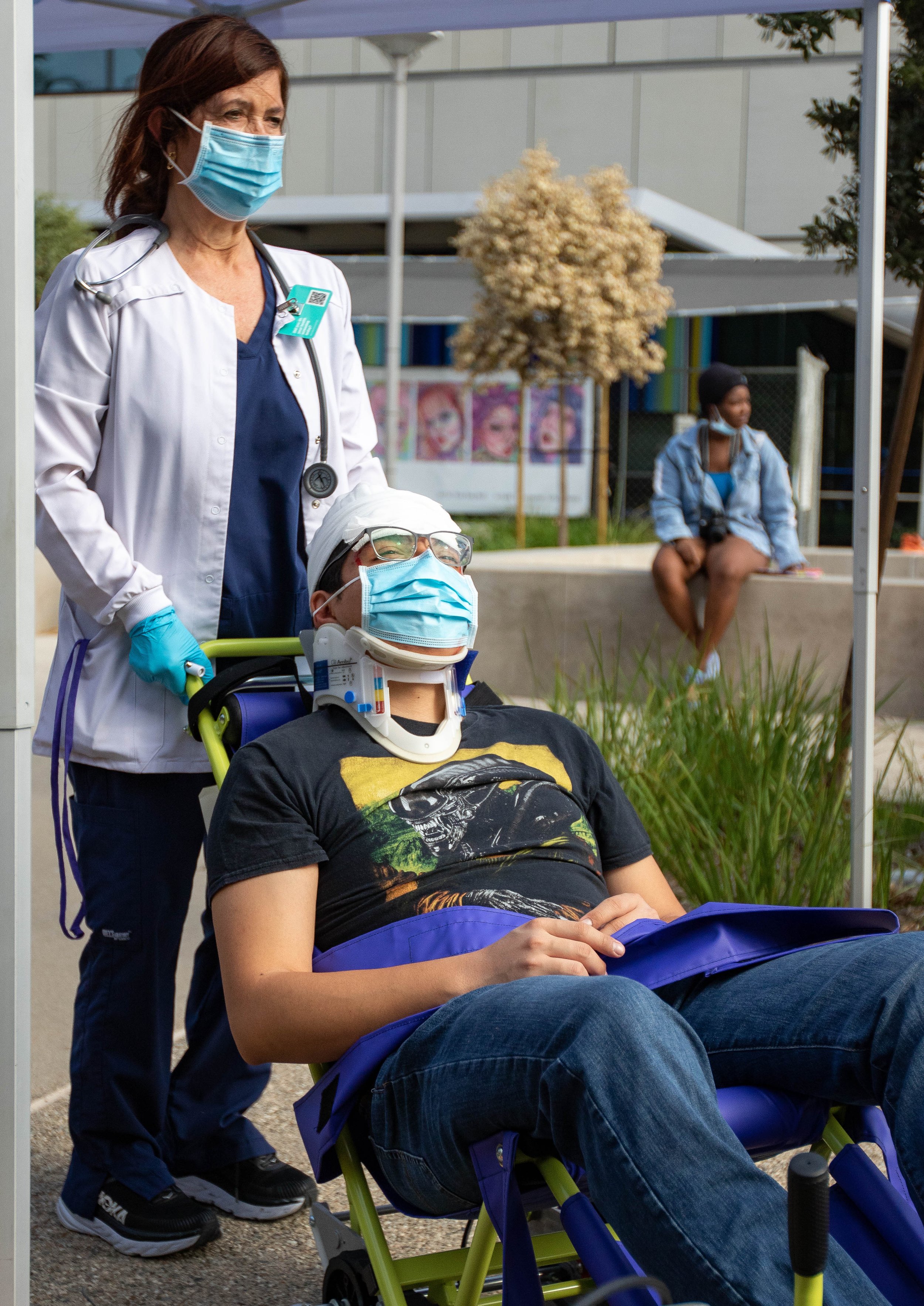  Santa Monica College (SMC) student Daniel Torres sits outside the SMC Student Services Center after participating as a simulated injured drill participant for the 2022 Great ShakeOut SoCal Earthquake Drill and Media Event, hosted by SMC on Oct. 20, 