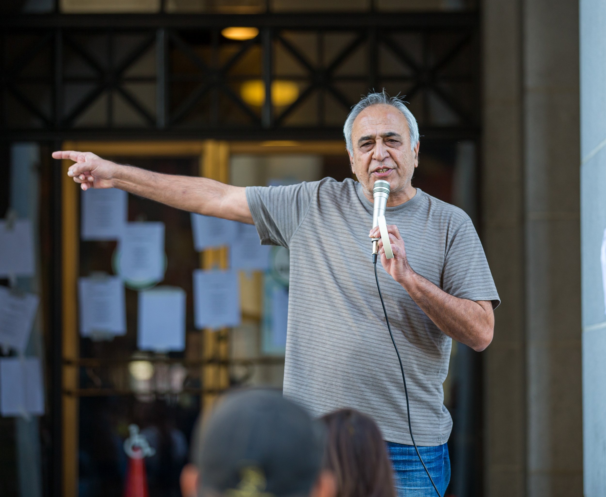  Hamid Kan speaking outside the Los Angeles City Hall to protesters calling for the resignation of Kevin De Leon on Tuesday, Oct. 18 at Los Angeles, Calif. (Danilo Perez | The Corsair) 