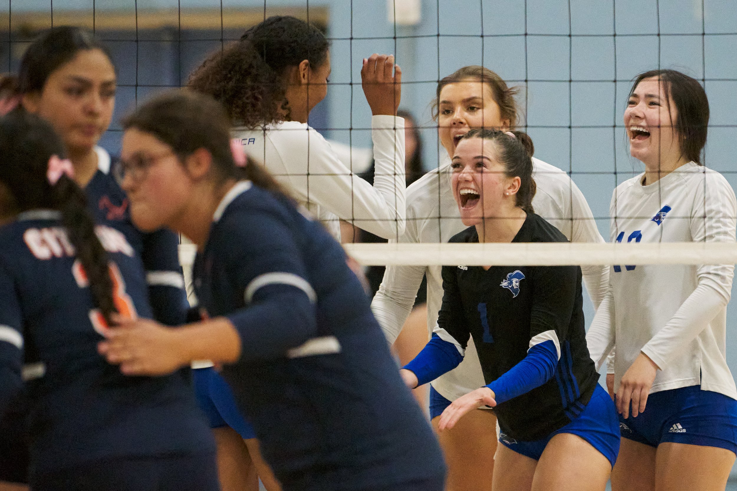  Members of the Santa Monica College Corsairs Women's Volleyball team celebrate scoring another point, while members of the Citrus College Owls don't, during the women's volleyball match on Wednesday, Oct. 19, 2022, at Corsair Gym in Santa Monica, Ca