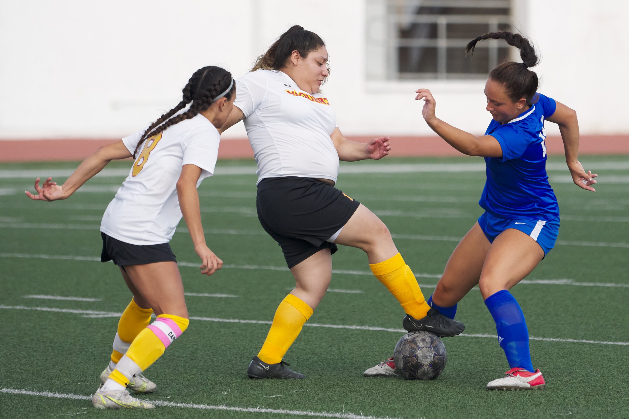  Glendale Community College Vaqueros' Vannessa Gallegos (center), with Isabel Moran (left), steals the ball from Santa Monica College Corsairs' Layla Perovich (right) during the women's soccer match on Friday, Oct. 21, 2022, at Corsair Field in Santa