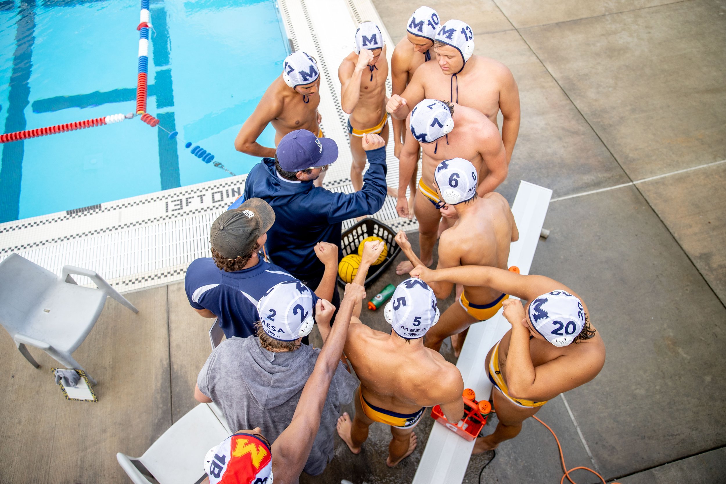  San Diego Mesa players confer during a waterpolo game at Santa Monica College in Santa Monica, Calif., on Friday, Oct. 21, 2022. (Ethan Swope | The Corsair)   