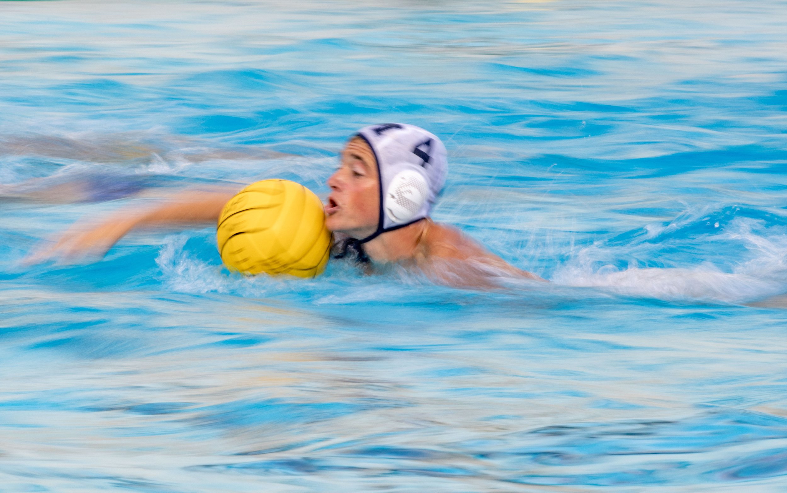  San Diego Mesa player Shane Cassidy (4) swims with the ball during a waterpolo game at Santa Monica College in Santa Monica, Calif., on Friday, Oct. 21, 2022. (Ethan Swope | The Corsair)   