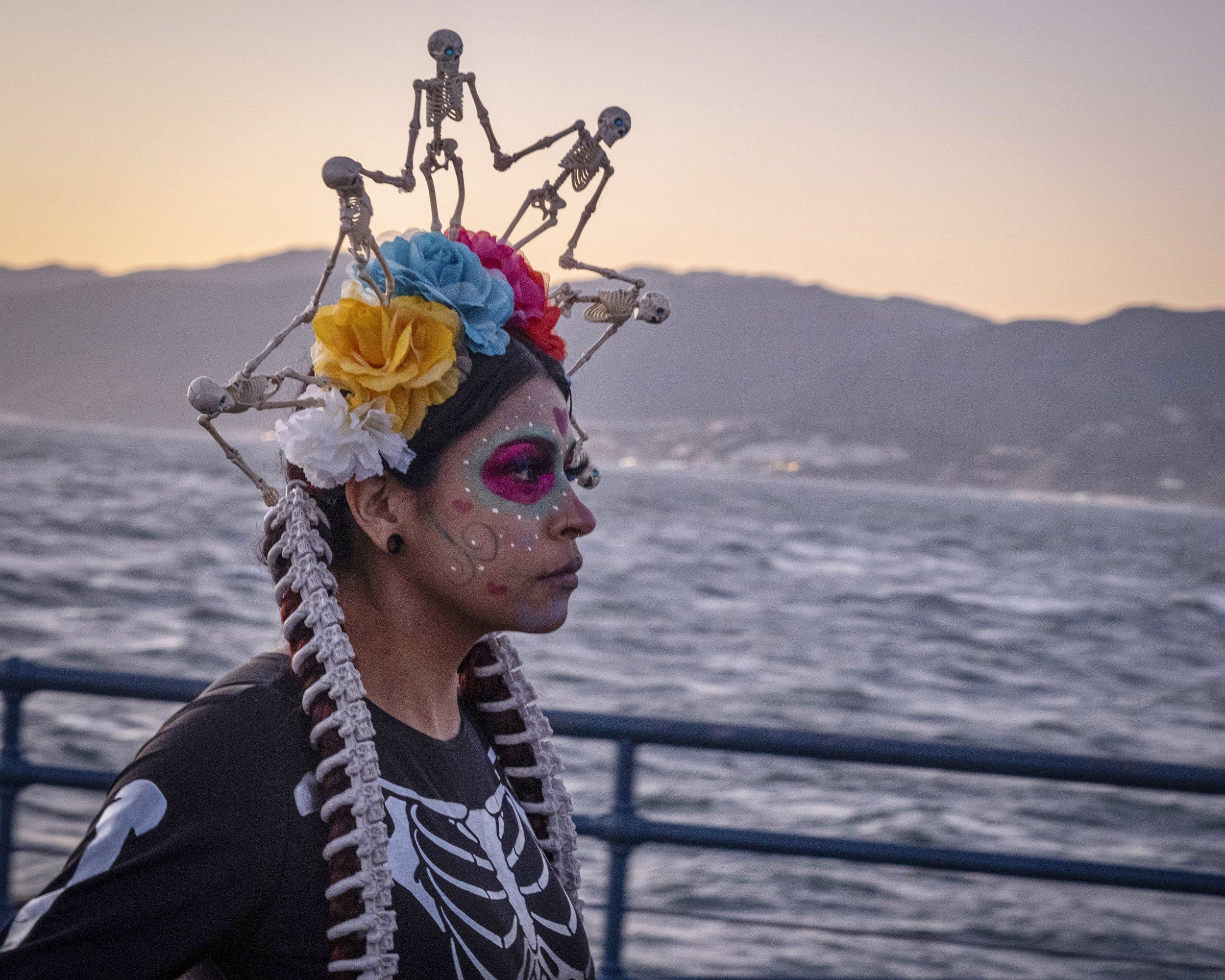  Dominique Medina walks from the west end of the Santa Monica pier, where Natives held a ceremony blessing their loved ones who have passed on. November 2, Santa Monica, Calif (Anna Sophia Moltke | The Corsair) 