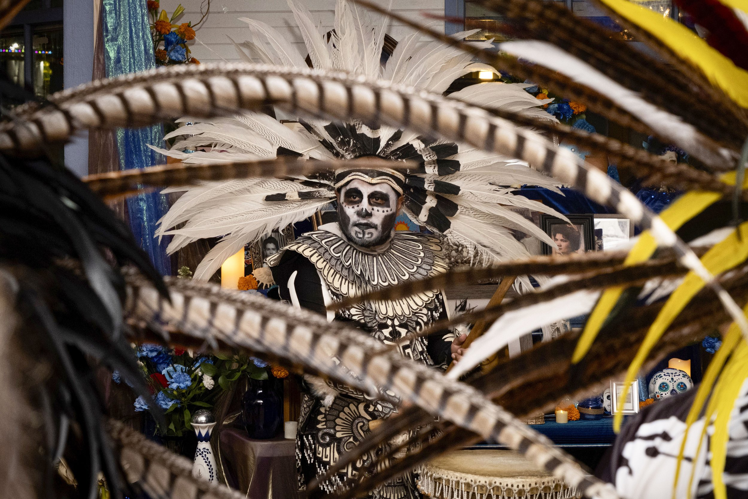  Member of the Kalpoli Tonelhuayo circle Fernando Ferrer drums in synchronization with the beat of the Azteca dance in front of the altars. Dia de Los Muertos alters were created in honor and remembrance of celebrating the lives of people’s loved one
