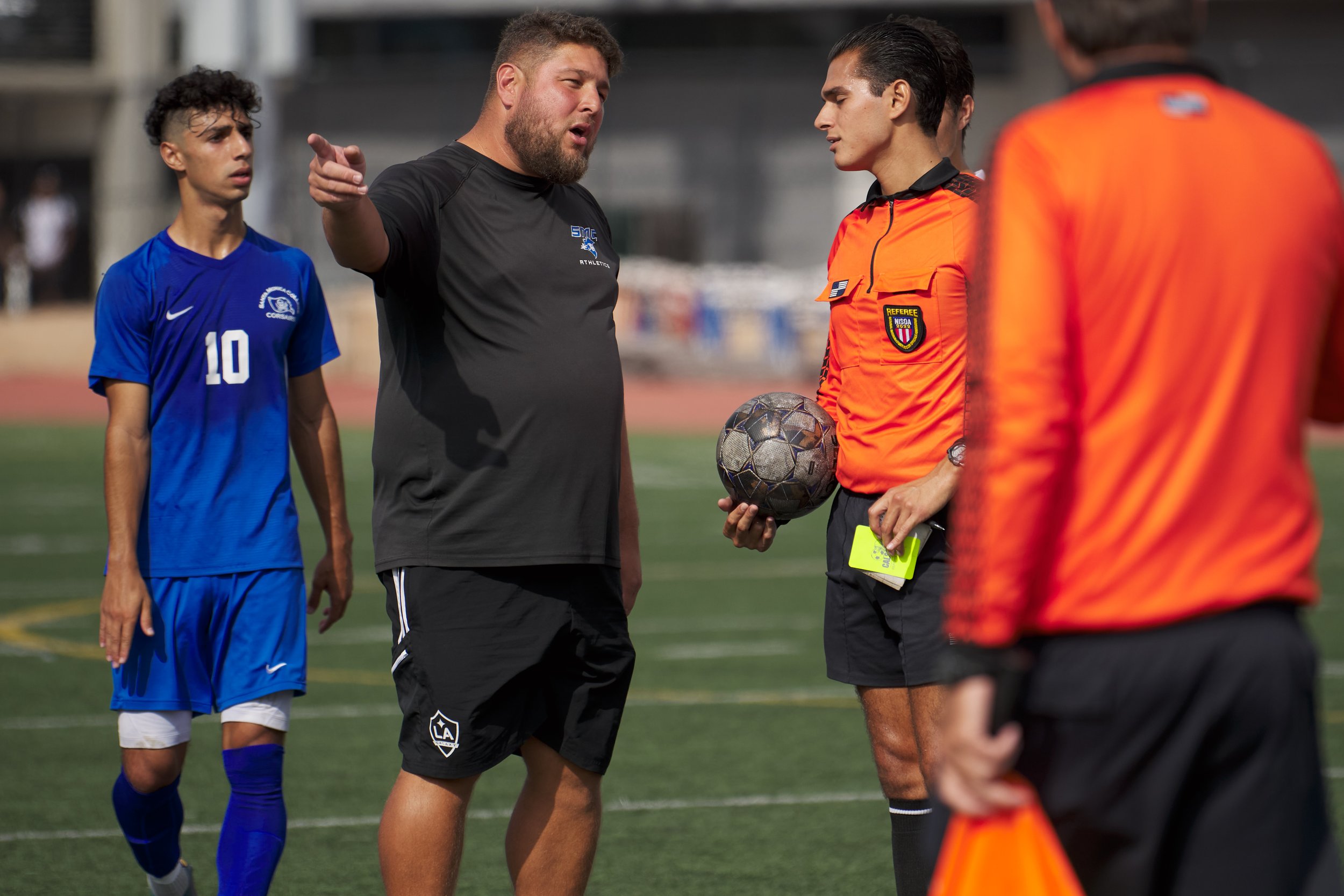  Santa Monica College Corsairs Men's Soccer Assistant Coach Rick Minars (center), with Roey Kivity (left), complains to the referee about the Los Angeles Mission College Eagles' aggressive behavior during the men's soccer match on Tuesday, Nov. 1, 20