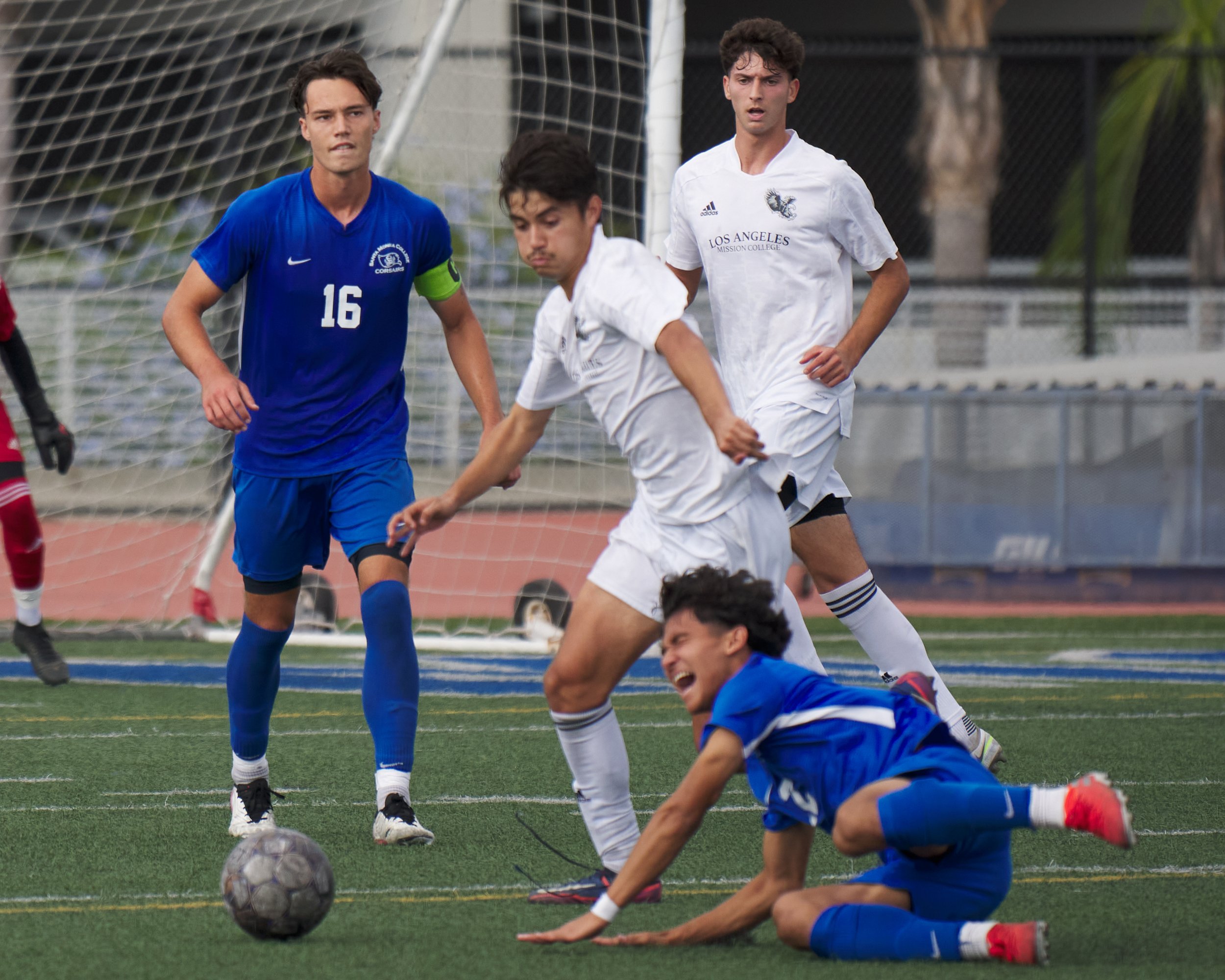  Los Angeles Mission College Eagles' Dominic Salazar (center) earned a red card for this foul against Santa Monica College Corsairs' Jason Moreno (bottom) during the men's soccer match, pictured with Kyler Sorber (left) and Yahav Arviv (rear) on Tues