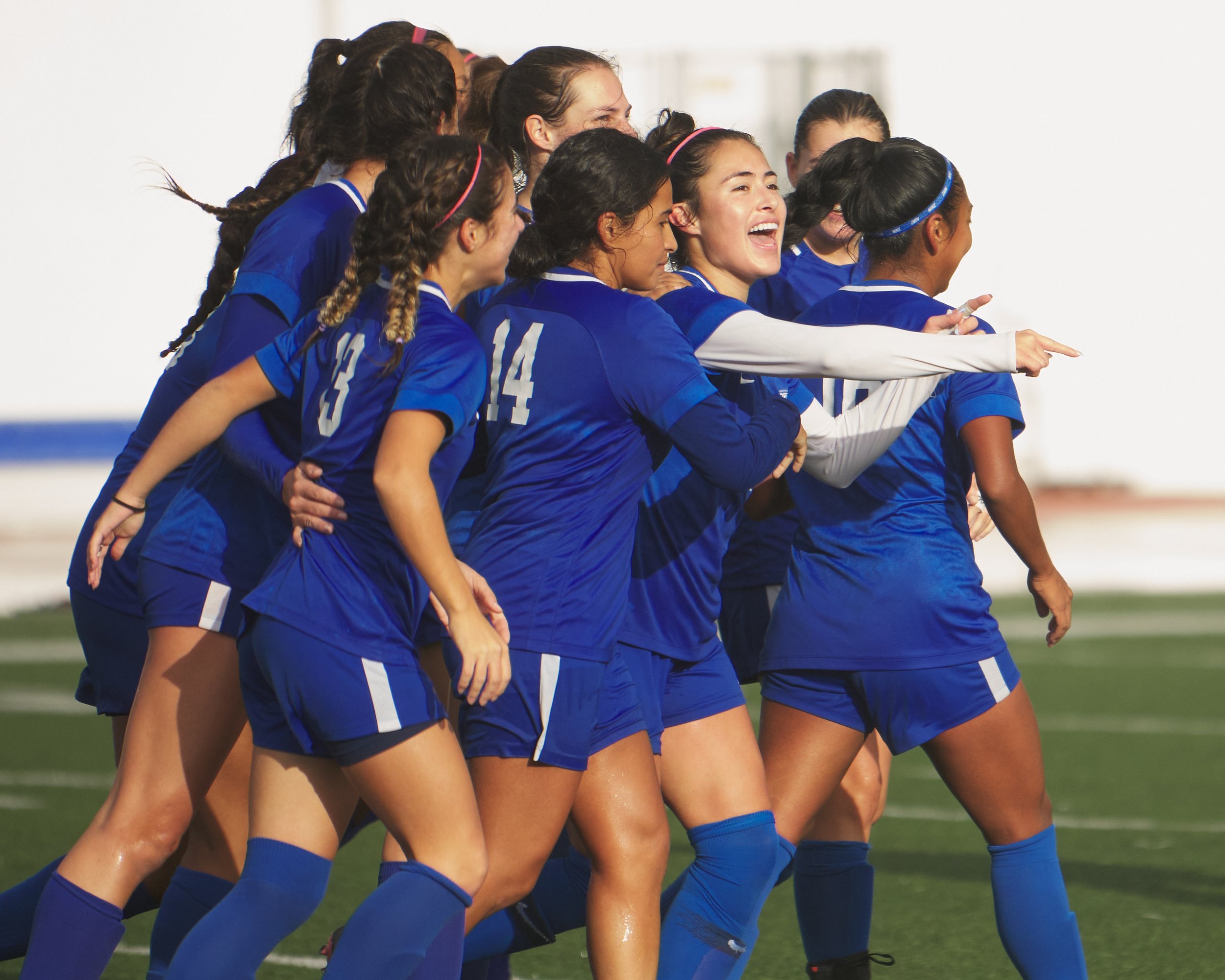  Members of the Santa Monica College Corsairs Women's Soccer team celebrate Ali Alban's (face visible) first goal of the women's soccer match against the Citrus College Owls on Tuesday, Nov. 8, 2022, at Corsair Field in Santa Monica, Calif. The Corsa