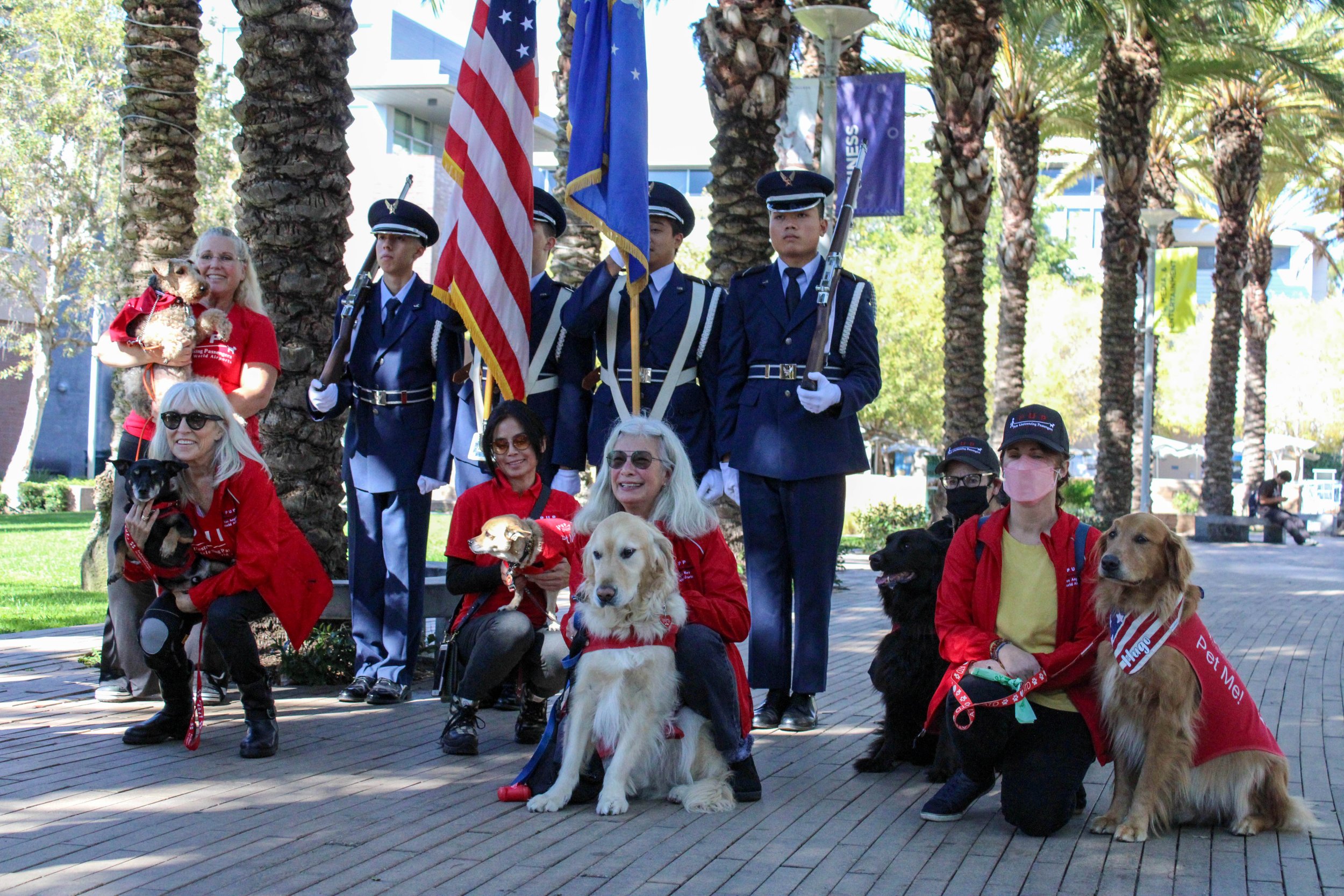  P.U.P. (Pets Unstressing Passengers) with the UCLA Air Force ROTC taking a group photo at the Veterans Ceremony at Santa Monica College. (Reis Novakovic | The Corsair) 