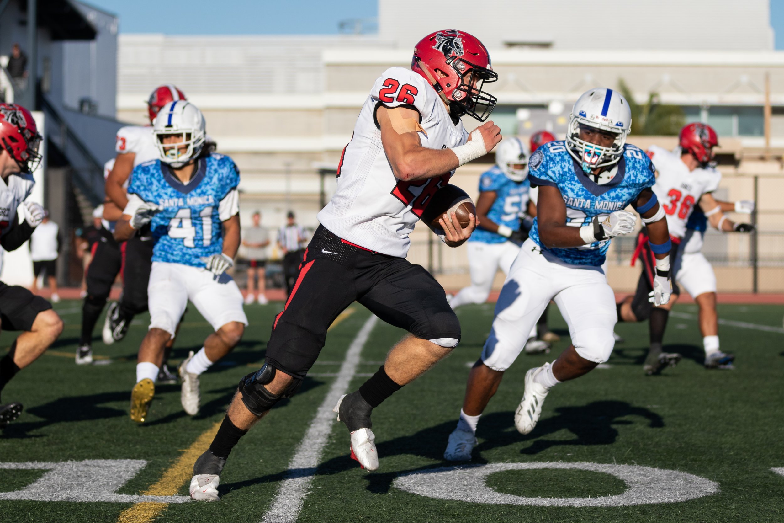  Santa Monica College Corsairs attemping to tackle Santa Barbara City College Vanquero Cameron Woolsey (26) as he runs the ball up the field during the third quarter of a recent home game on Saturday, Nov. 12, 2022, at Santa Monica College, Santa Mon