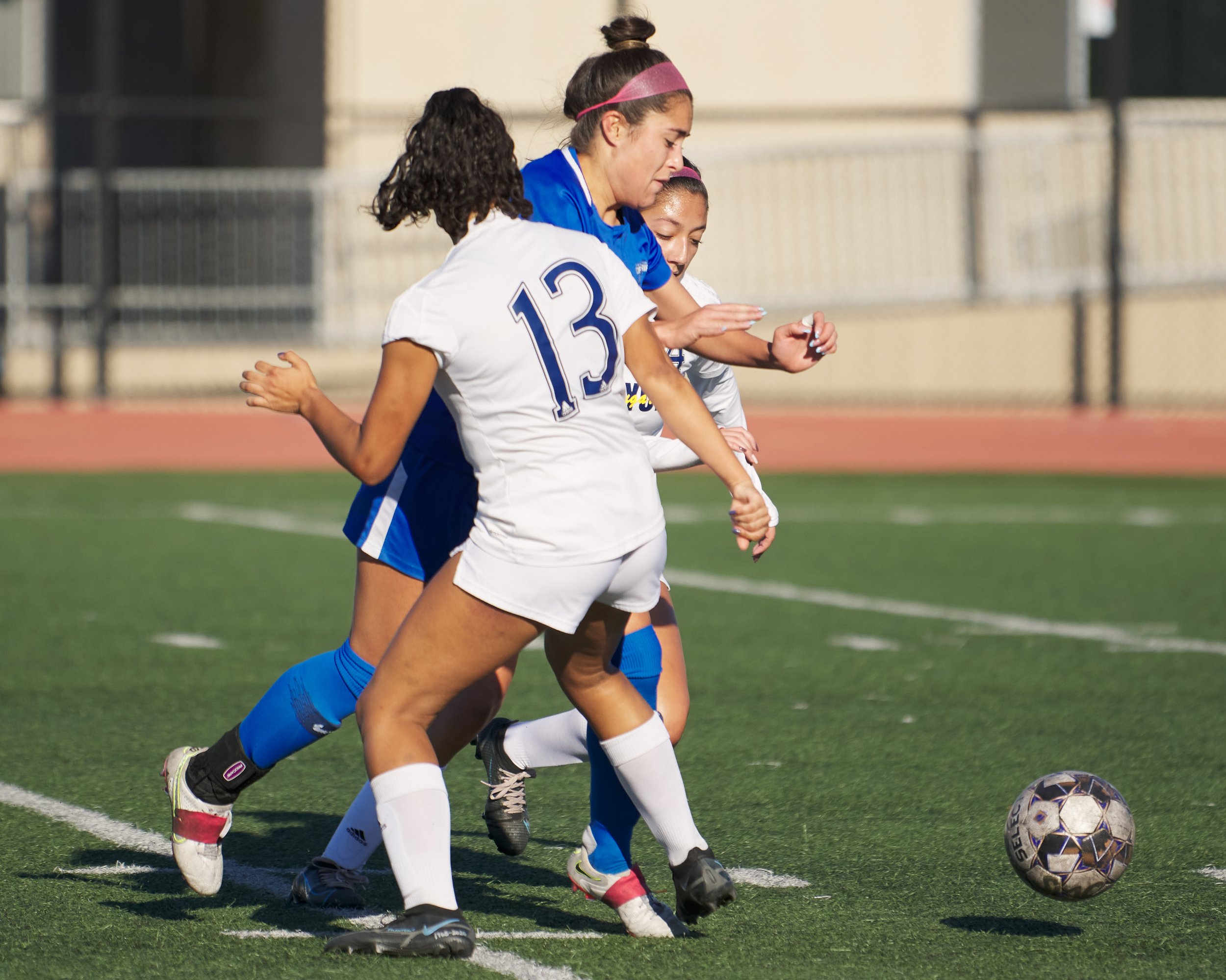  College of the Canyons Cougars' Natalia Zuluaga Ramirez (13) and Giselle Gomez (rear) gain the ball from Santa Monica College Corsairs' Ali Alban (center) during the women's soccer match on Thursday, Nov. 10, 2022, at Corsair Field in Santa Monica, 