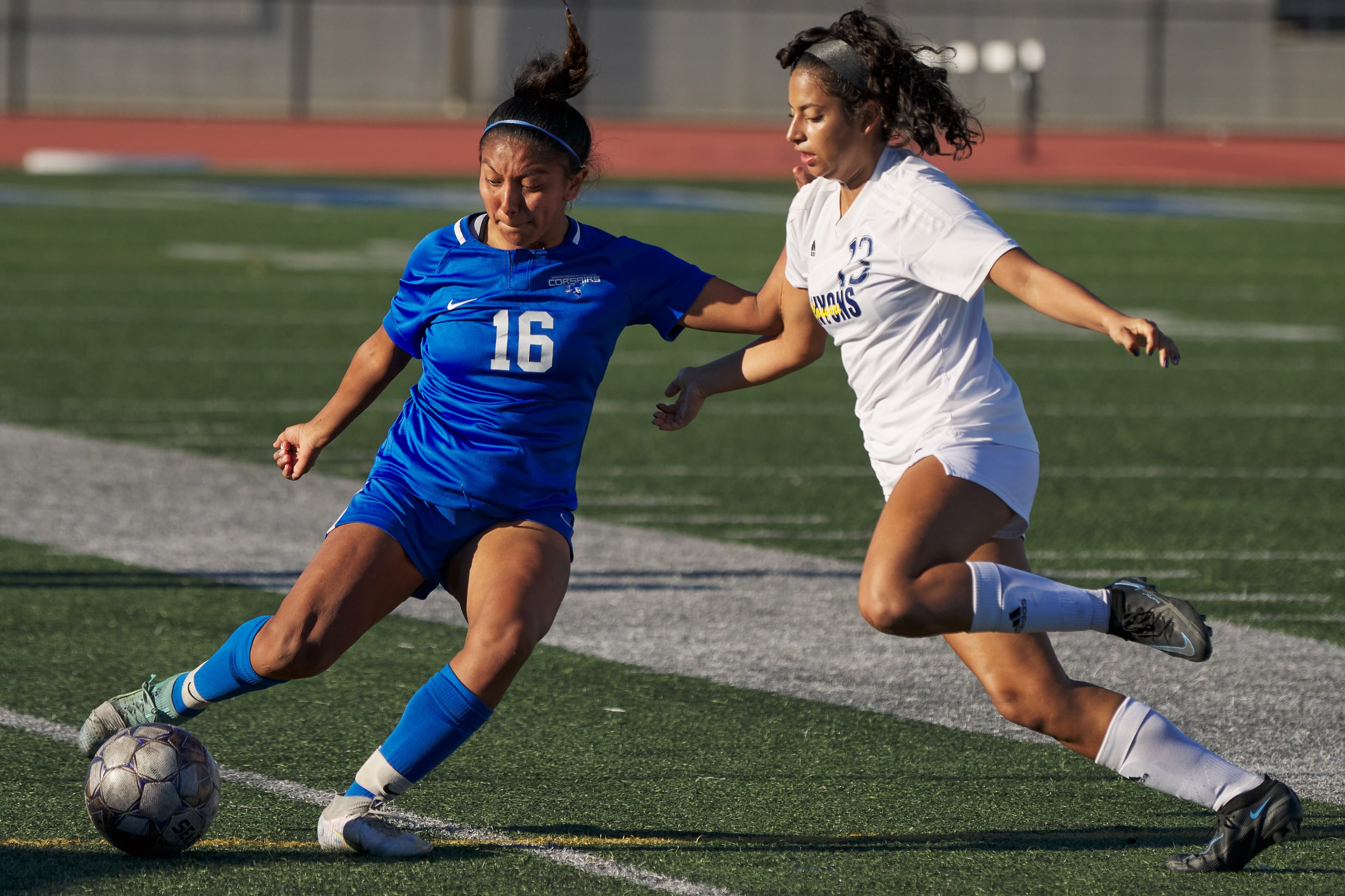 Santa Monica College Corsairs' Diana Gaspar kicks the ball away from College of the Canyons Cougars' Natalia Zuluaga Ramirez during the women's soccer match on Thursday, Nov. 10, 2022, at Corsair Field in Santa Monica, Calif. The Corsairs lost 3-0. 