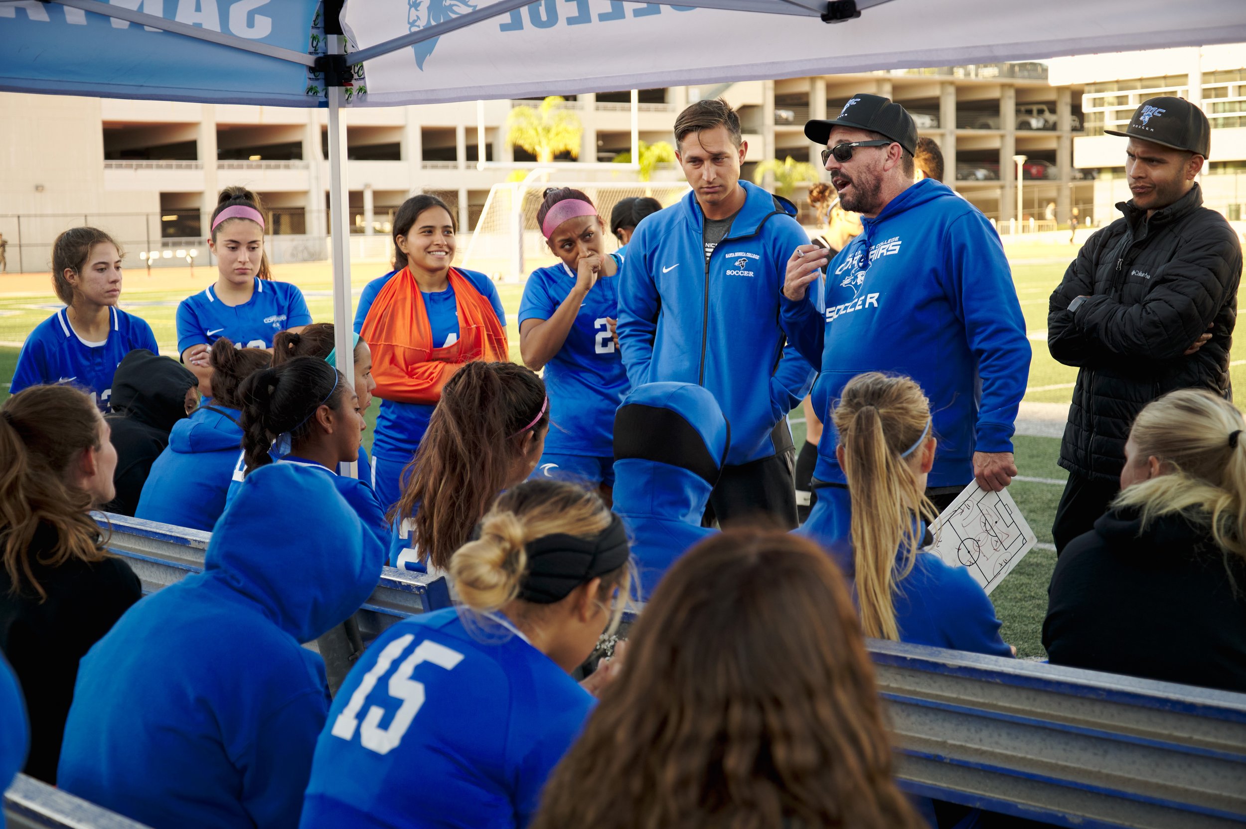  Santa Monica College Corsairs Women's Soccer Head Coach Aaron Benditson (sunglasses) talks to the team during the match against the College of the Canyons Cougars on Thursday, Nov. 10, 2022, at Corsair Field in Santa Monica, Calif. The Corsairs lost