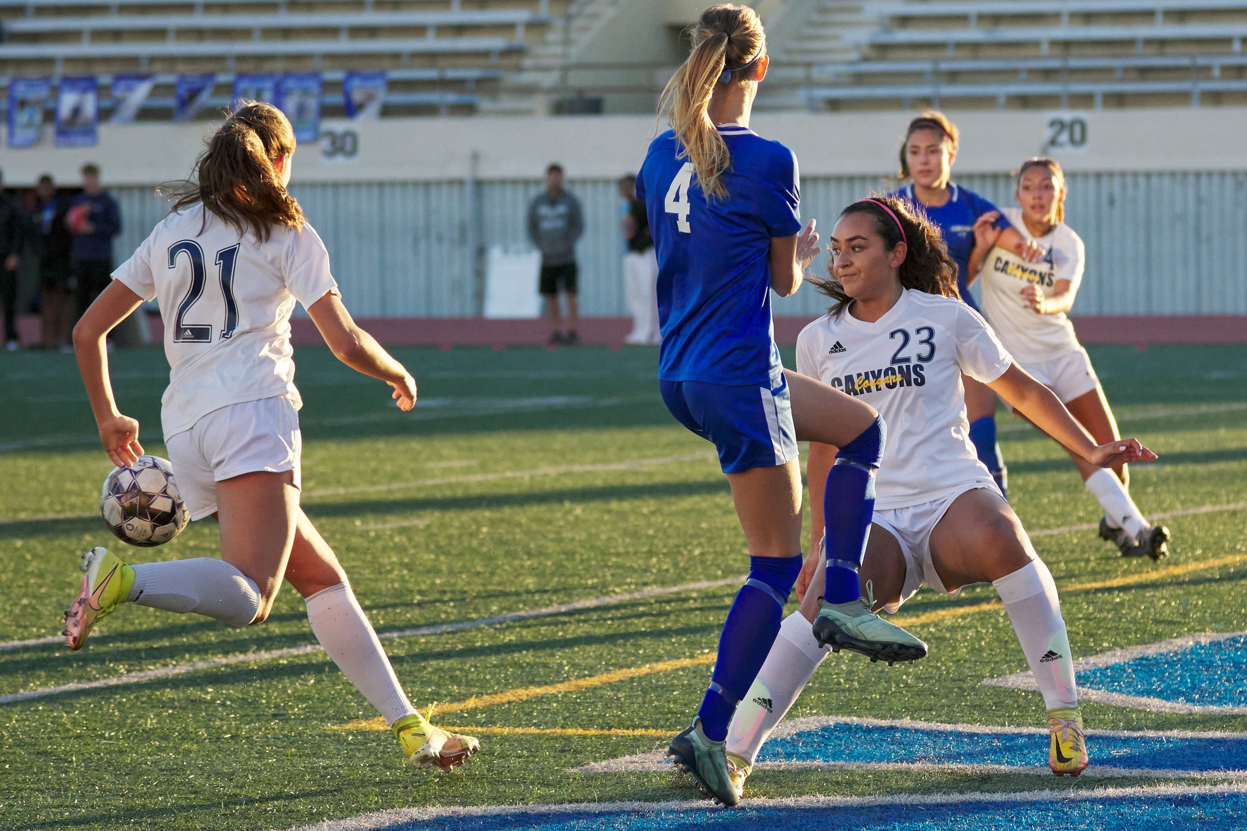  College of the Canyons Natalie Quezada (right) kicks the ball away from Santa Monica College Corsairs' Emma Rierstam (center) during the women's soccer match on Thursday, Nov. 10, 2022, at Corsair Field in Santa Monica, Calif. The Corsairs lost 3-0.
