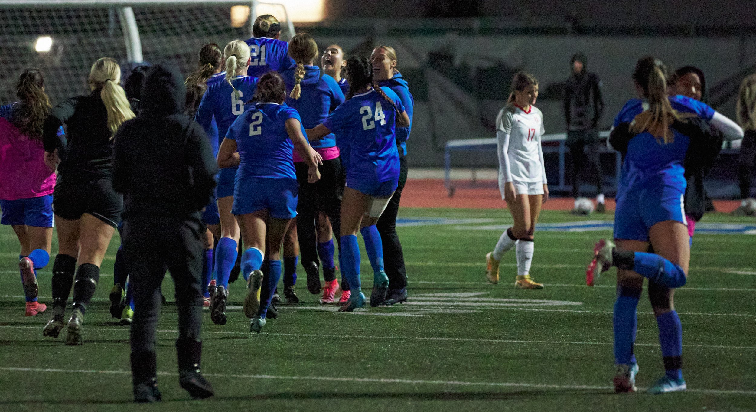  Bakersfield College Renegades' Mariah Myers-Caldarella (in white) walks back to her team as the Santa Monica College Corsairs Women's Soccer team rushes the field to celebrate their 1-0 playoff win on Wednesday, Nov. 16, 2022, at Corsair Field in Sa