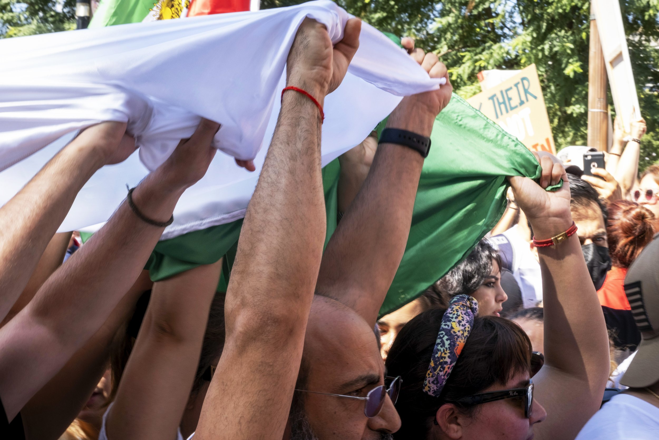  Supporters hold up a large Iranian flag at the Freedom Rally for Iran, in front of Los Angeles City Hall.  (Anna Sophia Moltke | The Corsair) 