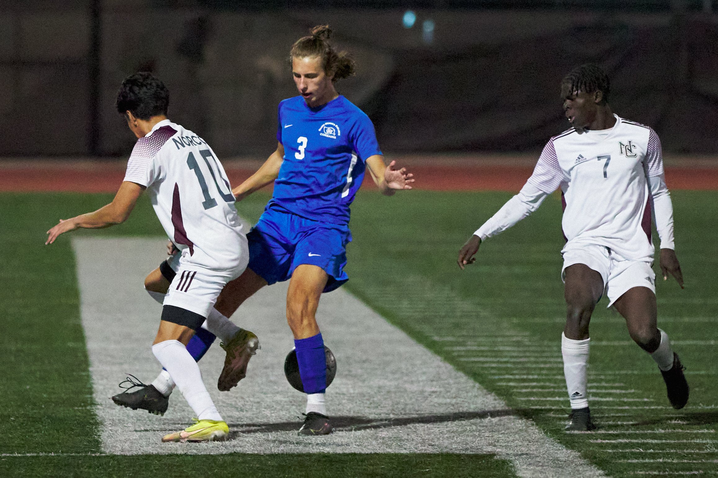  Norco College Mustangs' Aidan Olufson, Dominic Kienzle, and Santa Monica College Corsairs' Axel Green during the men's soccer match on Saturday, Nov. 19, 2022, at Corsair Field in Santa Monica, Calif. (Nicholas McCall | The Corsair) 