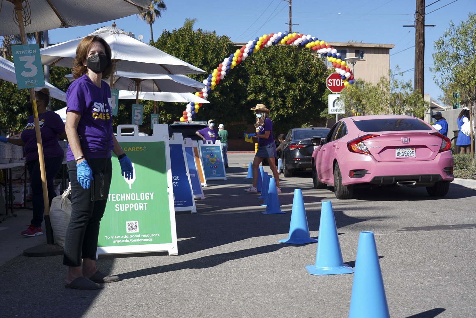  Volunteers prepare to receive student recipients during Santa Monica College's 3rd Giving Thanks(Giving) charity food distribution event Tuesday, Nov. 22 2022. The drive-thru market featured free care packages designed to ease the burden faced by fo