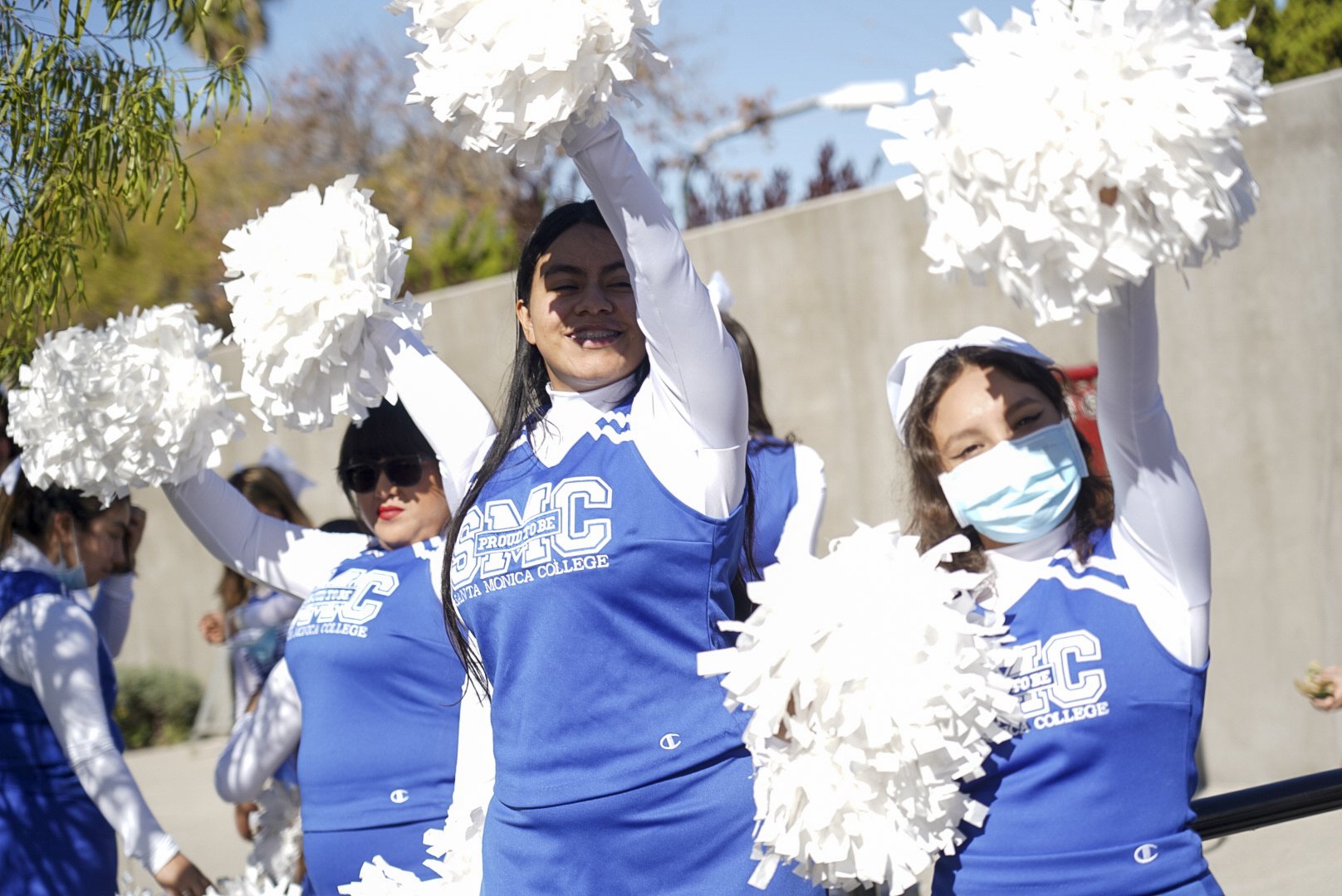  Santa Monica College Corsair Cheerleaders pose for a photo  during Santa Monica College's 3rd Giving Thanks(Giving) charity food distribution event Tuesday, Nov. 22 2022. The drive-thru market featured free care packages designed to ease the burden 