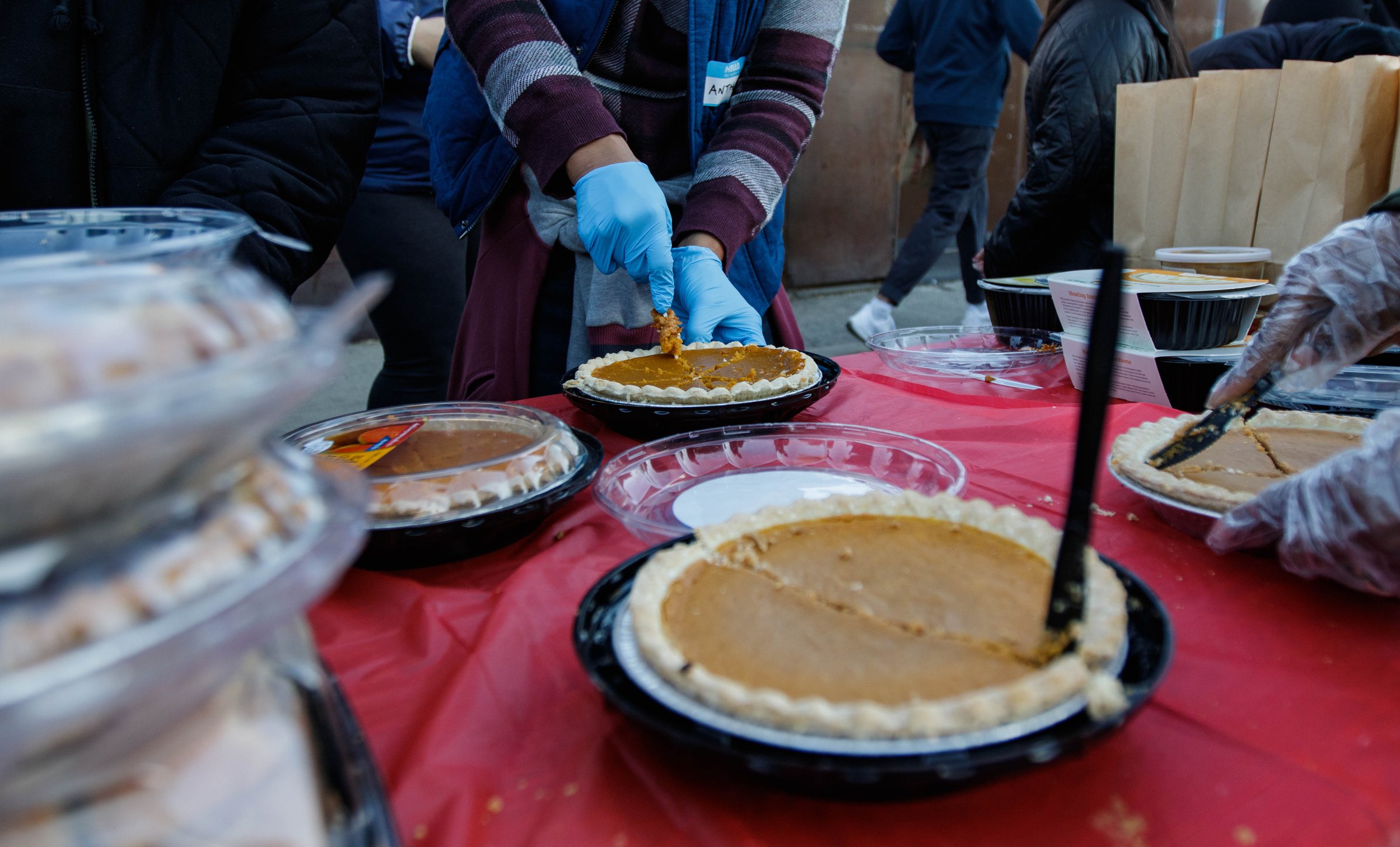  Before the event, volunteers cut up the pumpkin pie into slices so it can be given away. For the past 10 years, Lost Angels Org a non profit based in Los Angeles has been been giving out food and utilities to the homeless in Venice on Thanksgiving D