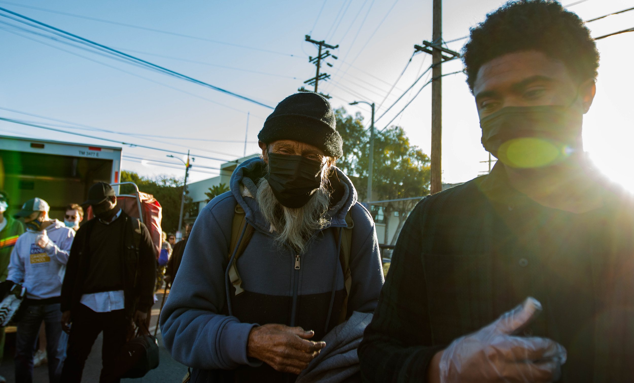  65 year old Keith Joslin is guided by a volunteer to the tables filled with free thanksgiving food prepared by Lost Angels Org volunteers. For the past 10 years, Lost Angels Org a non profit based in Los Angeles has been been giving out food and uti