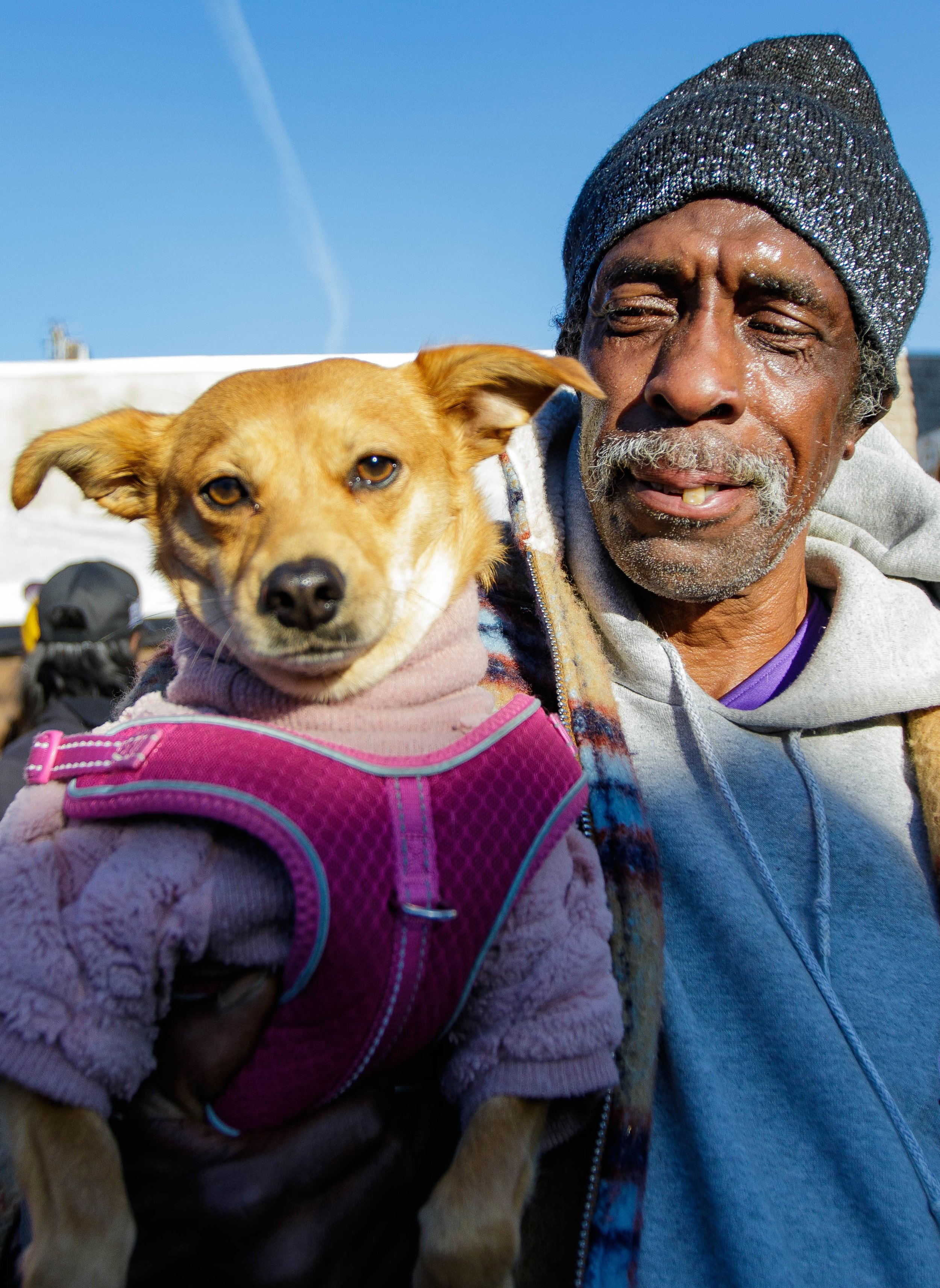  62-year-old Steven Sheffield and his dog Princess line up for free food at the Lost Angels Org Thanksgiving event. Sheffield got Princess 4 months ago after the passing of his wife and has been living in homeless centers with her. Lost Angels Org is