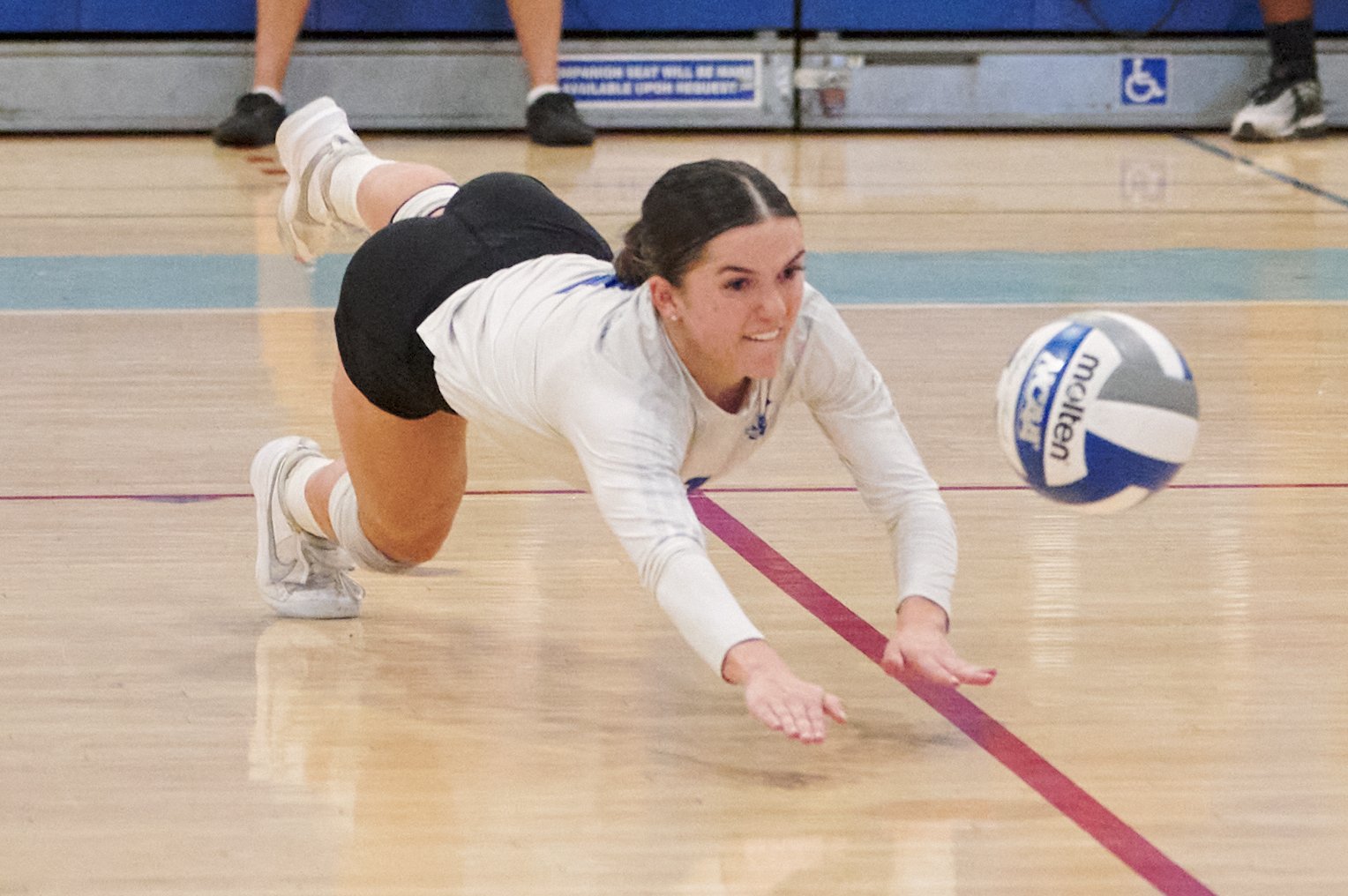  Santa Monica College Corsairs' Halle Anderson dives for the ball during the women's volleyball match against the Bakersfield College Renegades on Wednesday, Sept. 28, 2022, at the Corsair Gym in Santa Monica, Calif. The Corsairs won 3-2. (Nicholas M